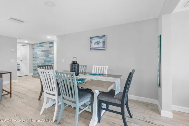 a kitchen with stainless steel appliances a stove a sink and a refrigerator