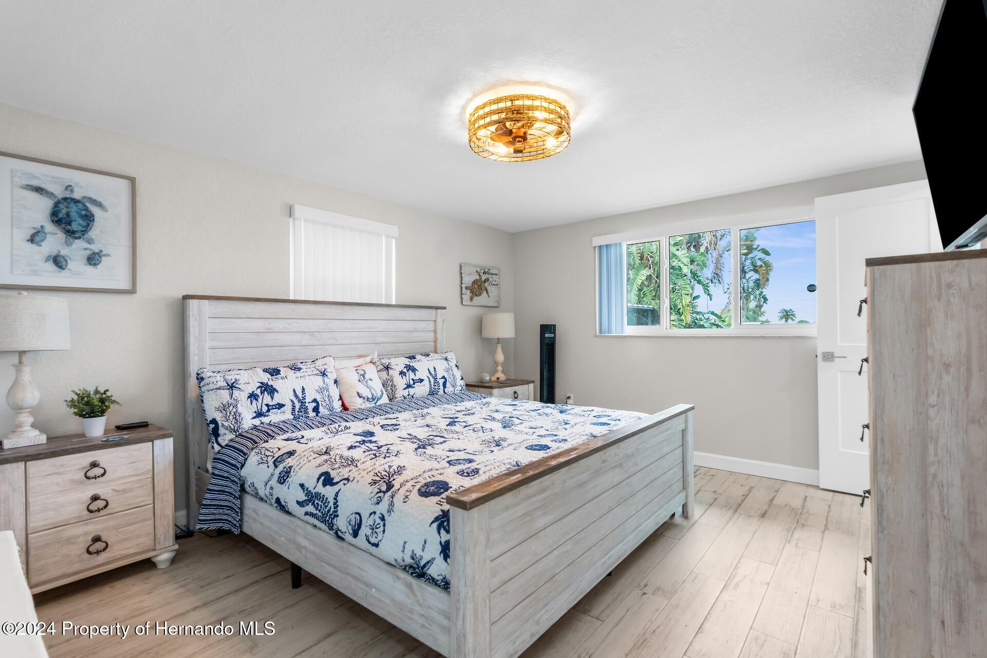 12535 3rd Isle Hudson, FL 34667 - Photo 24 of 46 a bedroom with a bed and a window