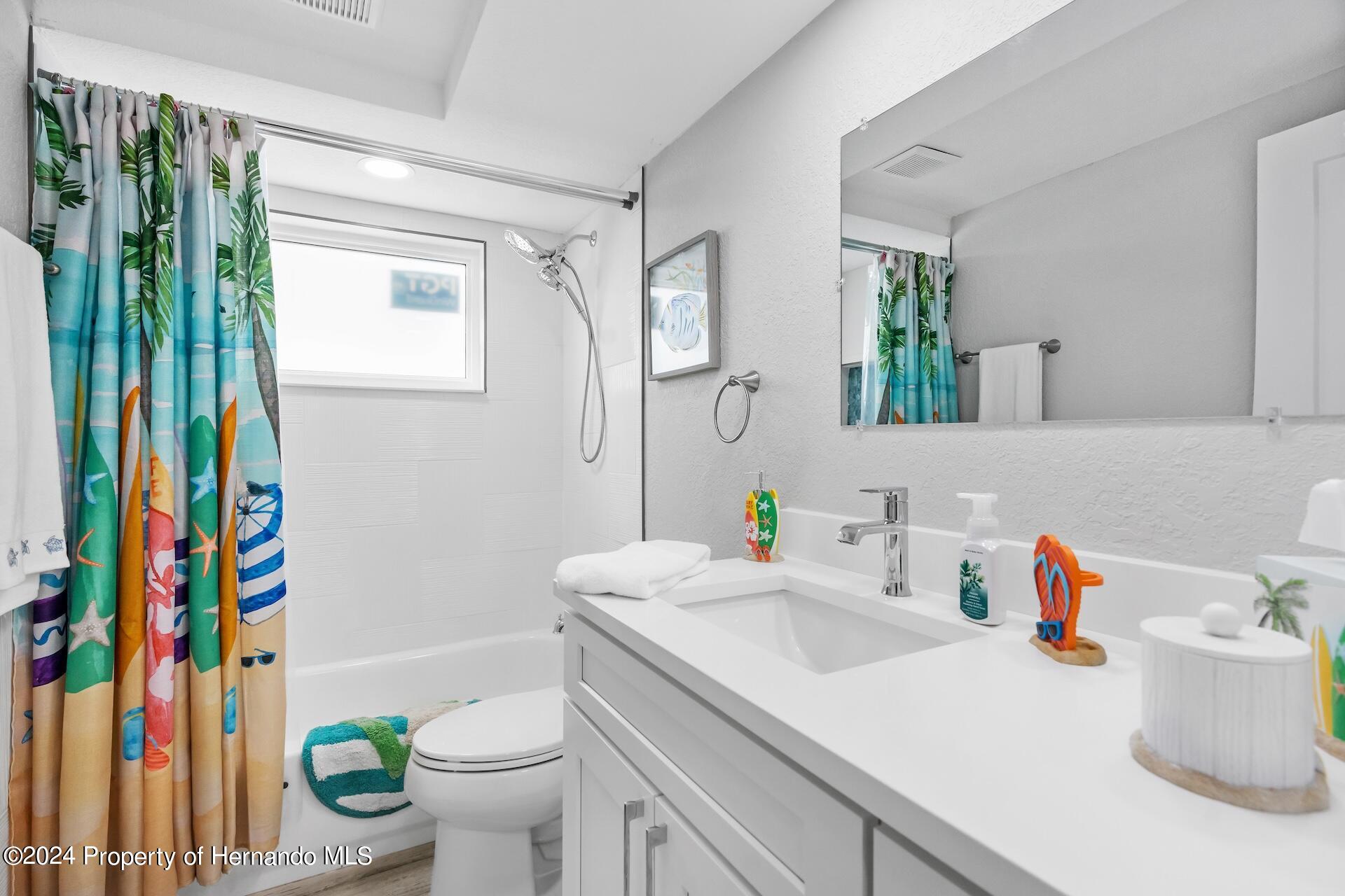 12535 3rd Isle Hudson, FL 34667 - Photo 31 of 46 a bathroom with a sink toilet and shower