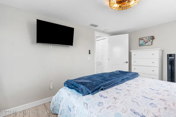 a living room with furniture a chandelier and a piano