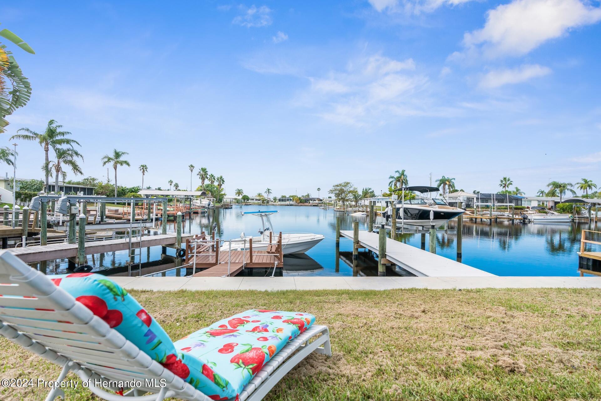 12535 3rd Isle Hudson, FL 34667 - Photo 39 of 46 a view of a swimming pool with an outdoor seating