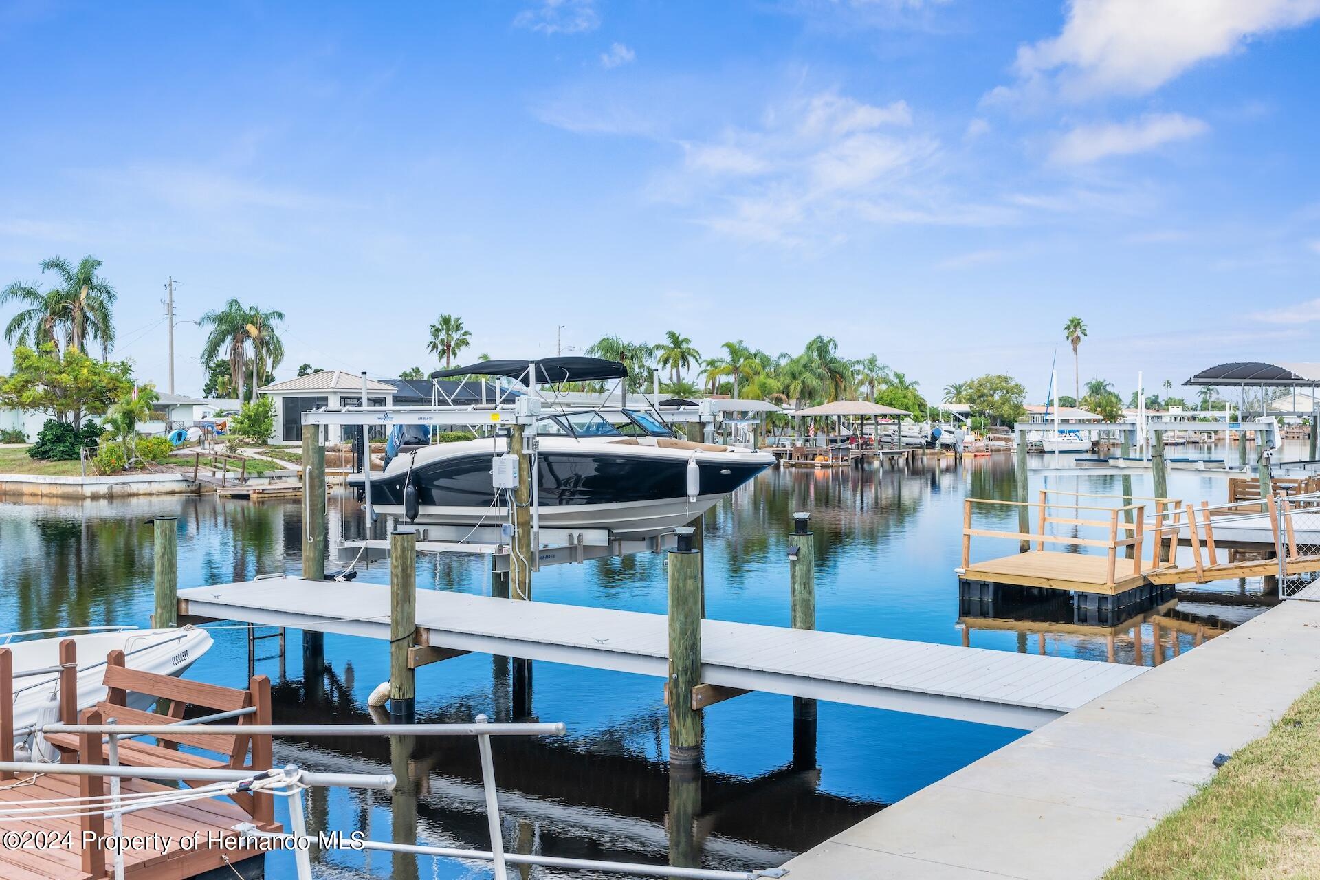 12535 3rd Isle Hudson, FL 34667 - Photo 41 of 46 a view of a lake and outdoor space