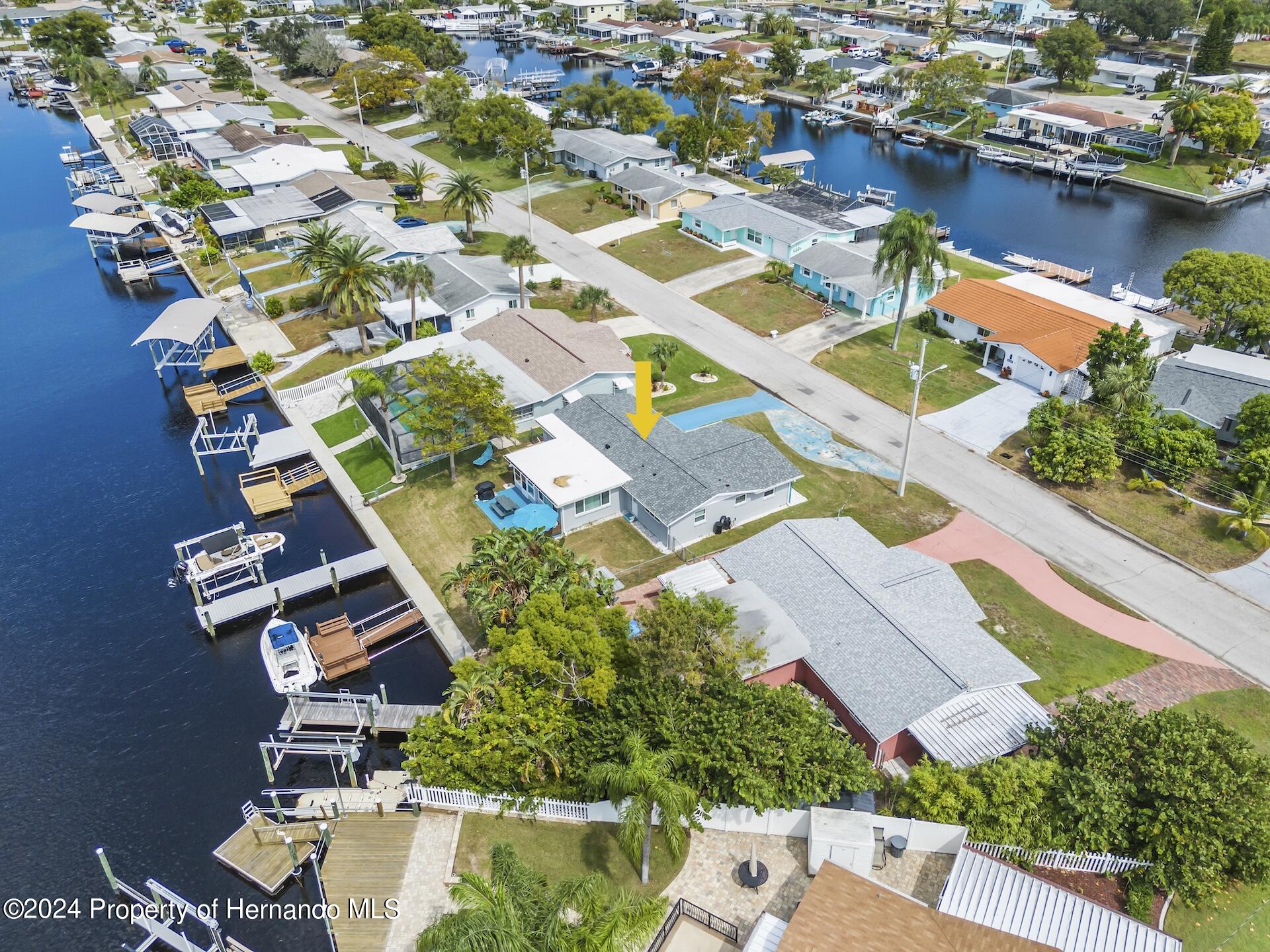 12535 3rd Isle Hudson, FL 34667 - Photo 5 of 46 an aerial view of residential houses with outdoor space and lake view