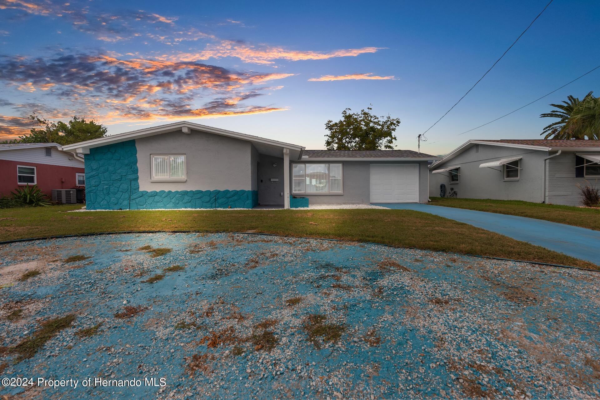 12535 3rd Isle Hudson, FL 34667 - Photo 8 of 46 a view of a house with a yard