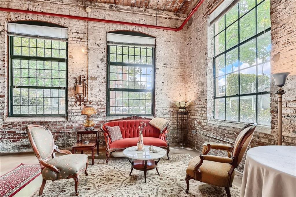170 Boulevard Southeast, Unit 101F Atlanta, GA 30312 - Photo 1 of 11 a living room with furniture and a large window