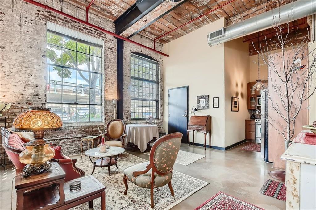 170 Boulevard Southeast, Unit 101F Atlanta, GA 30312 - Photo 3 of 11 a living room with furniture and a window