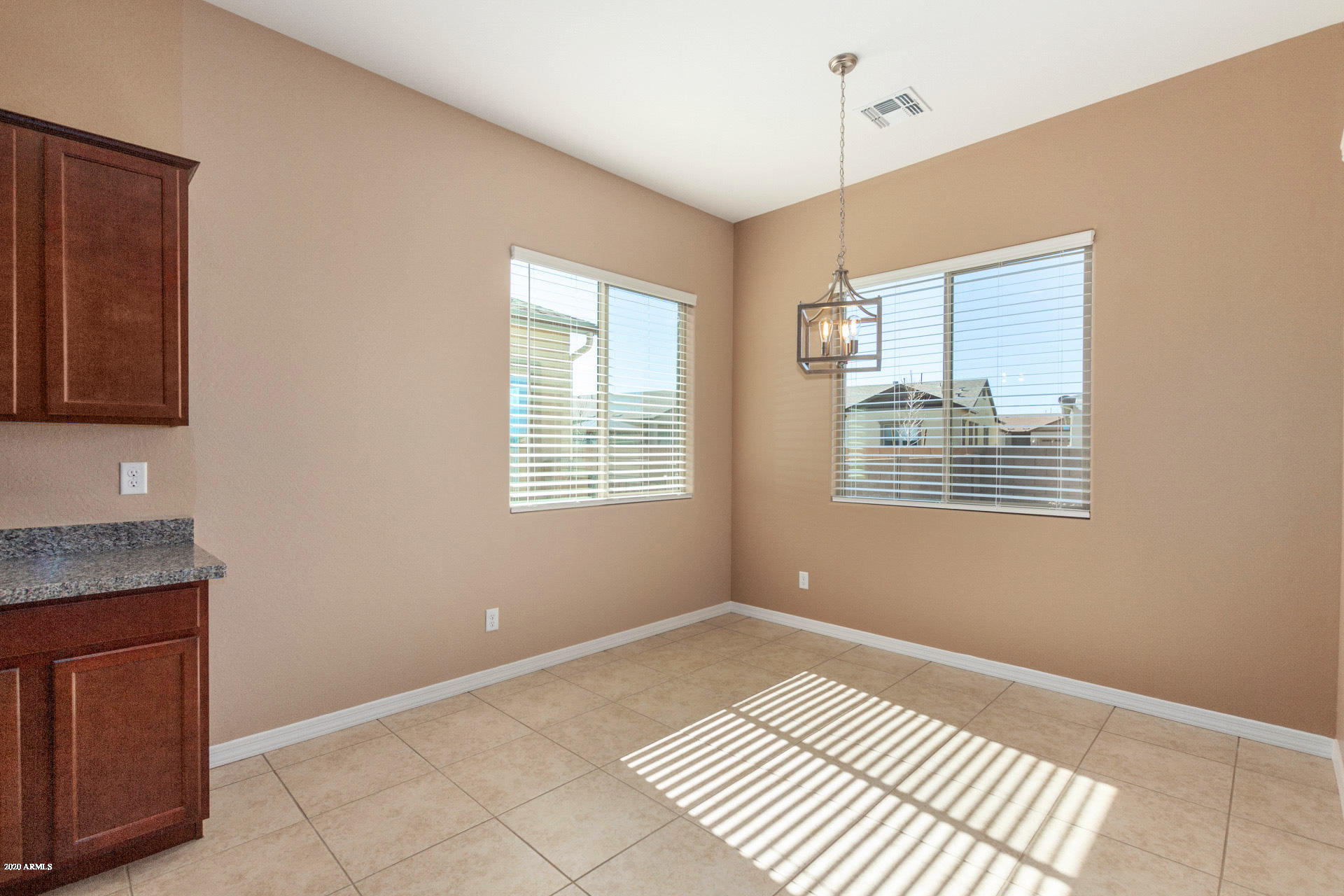 8642 Wandering Creek Road Prescott Valley, AZ 86315 - Photo 11 of 29 a view of an empty room with a window