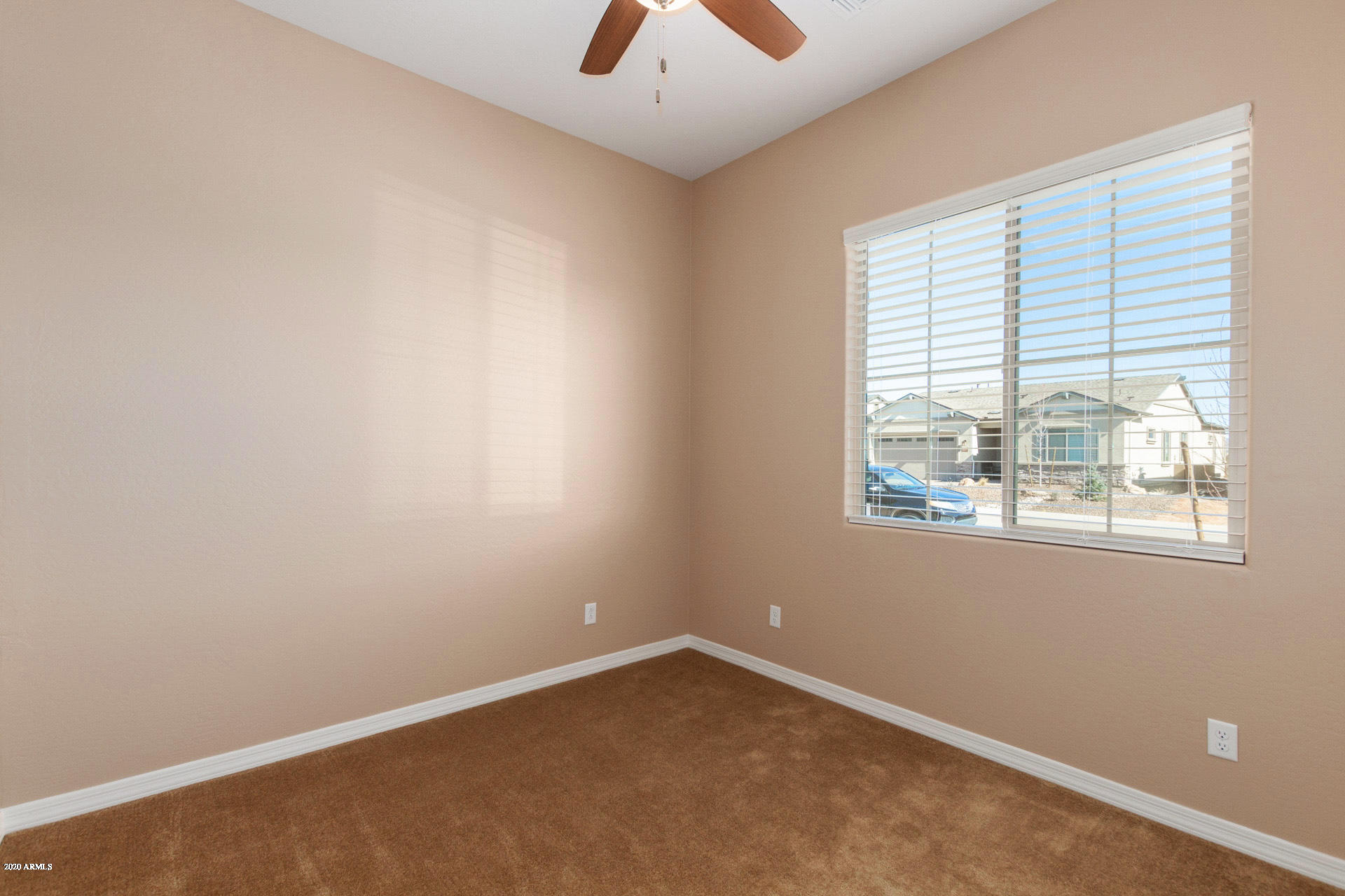 8642 Wandering Creek Road Prescott Valley, AZ 86315 - Photo 16 of 29 an empty room with a window
