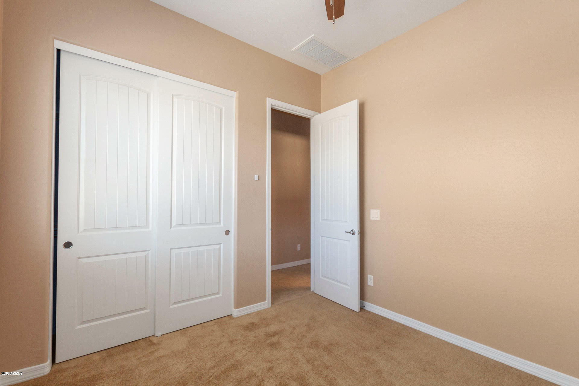 8642 Wandering Creek Road Prescott Valley, AZ 86315 - Photo 17 of 29 an empty room with closet