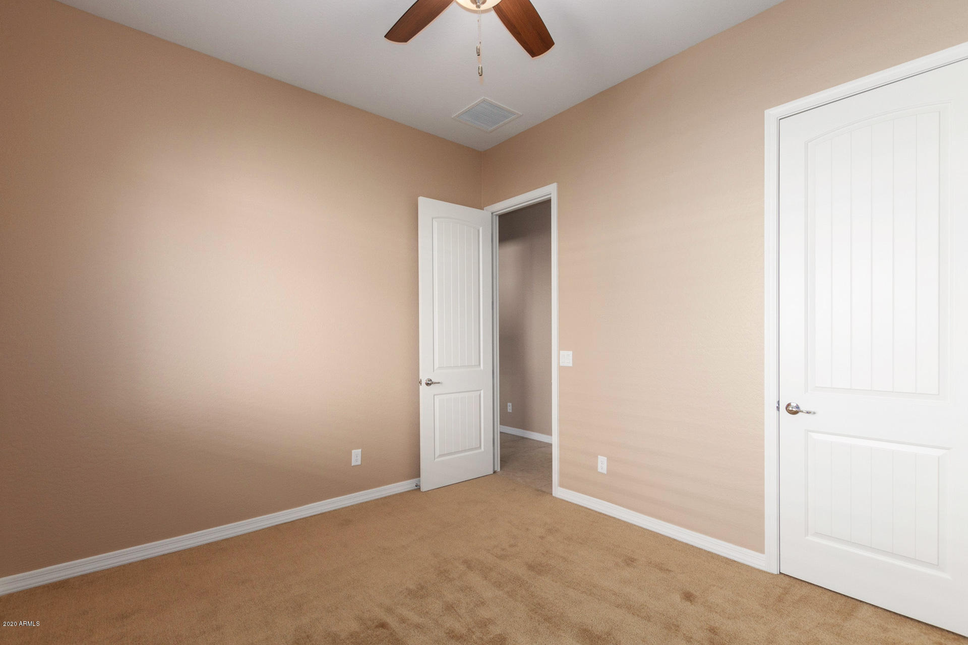 8642 Wandering Creek Road Prescott Valley, AZ 86315 - Photo 19 of 29 an empty room with chandelier fan
