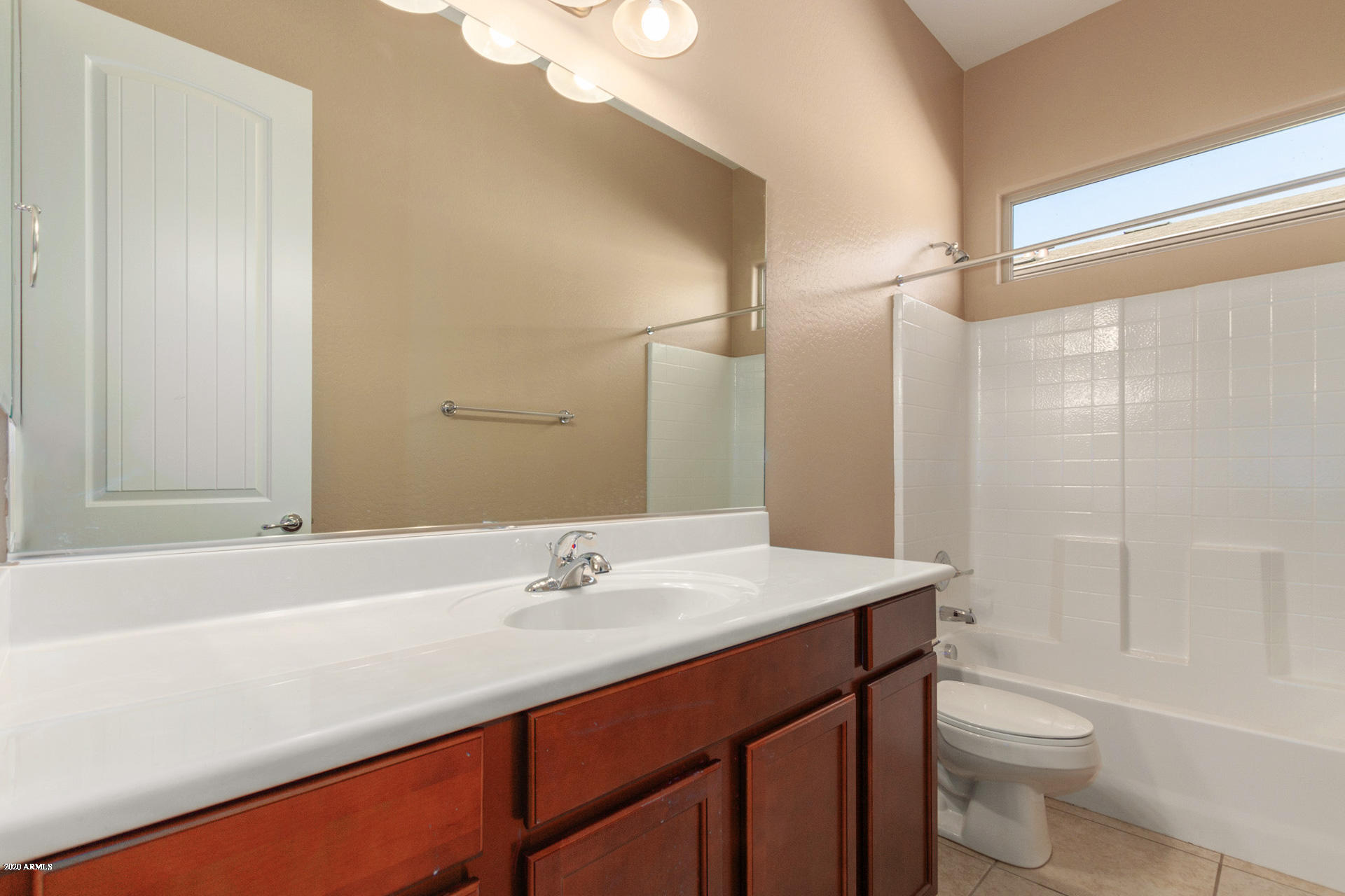 8642 Wandering Creek Road Prescott Valley, AZ 86315 - Photo 20 of 29 a bathroom with a sink a toilet and shower