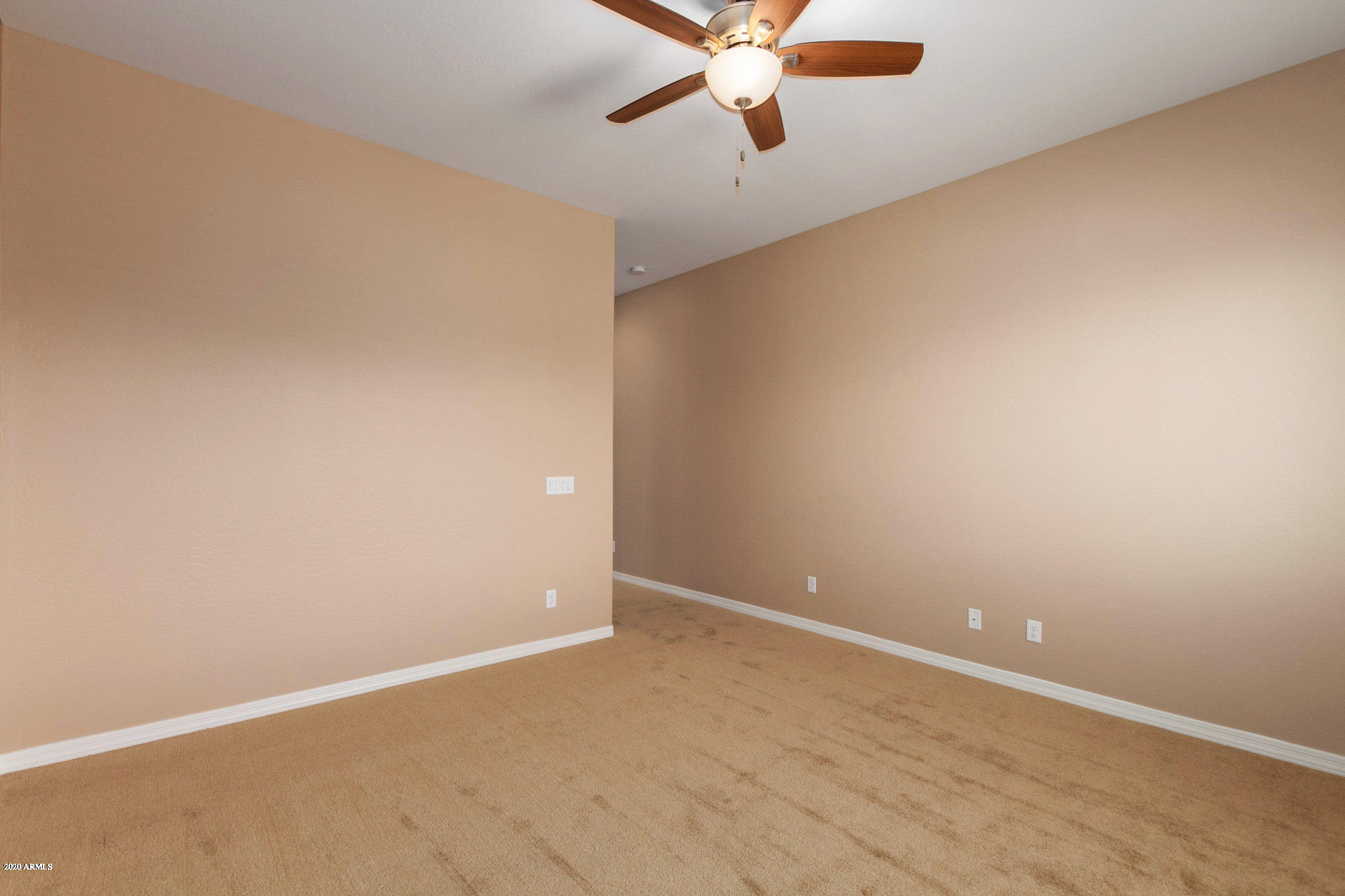 8642 Wandering Creek Road Prescott Valley, AZ 86315 - Photo 22 of 29 an empty room with a window and a ceiling fan