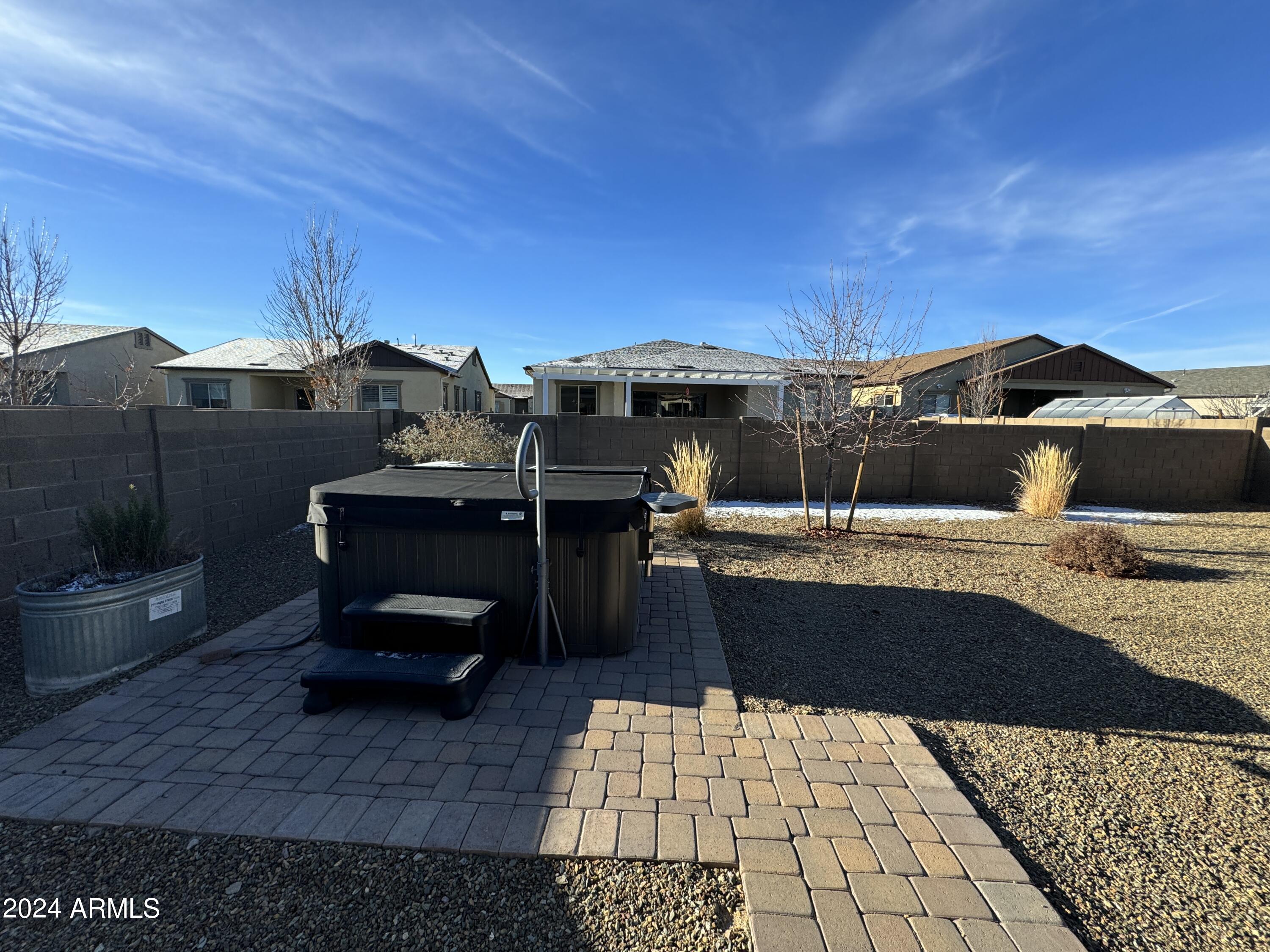 8642 Wandering Creek Road Prescott Valley, AZ 86315 - Photo 27 of 29 a view of a terrace with chairs