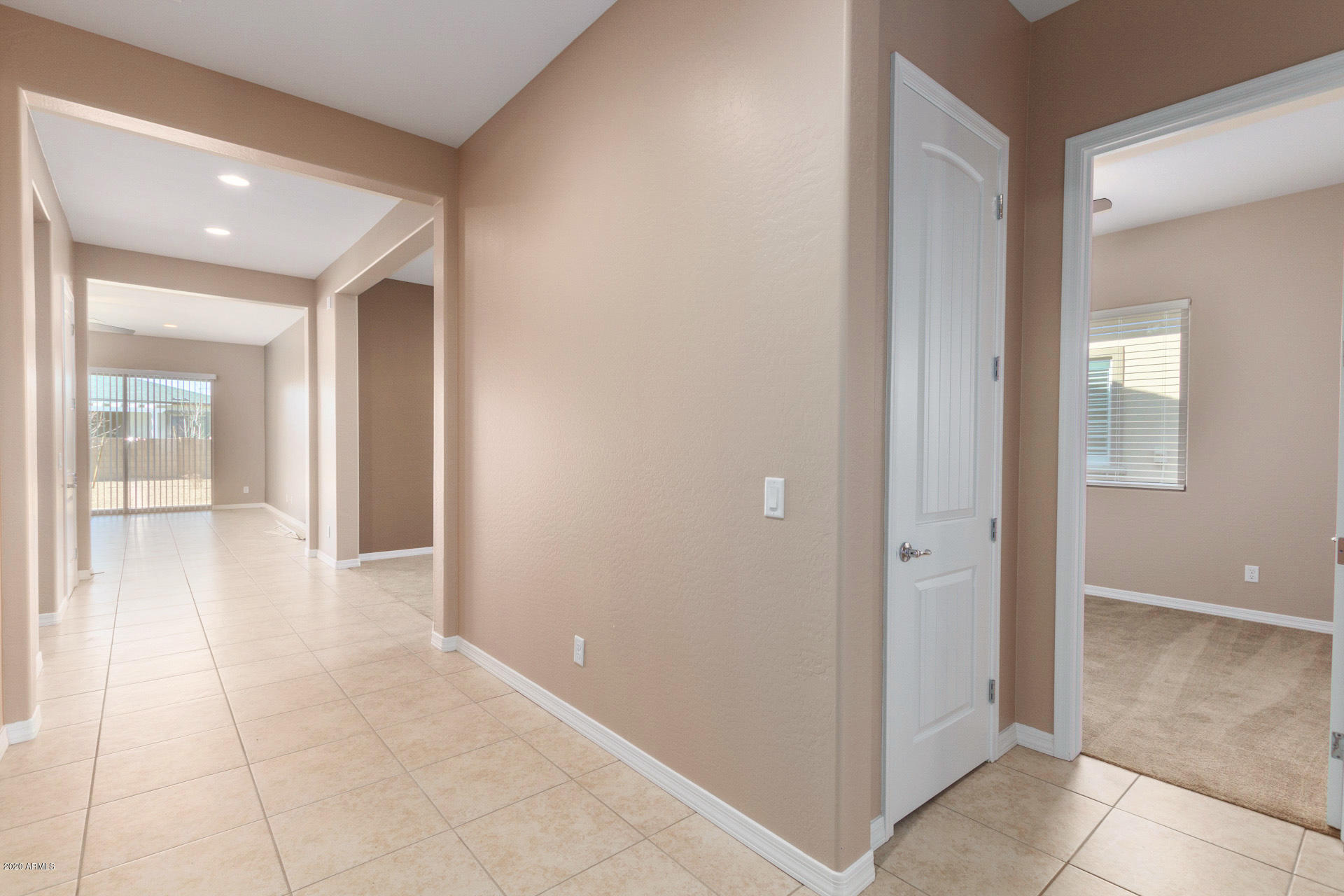 8642 Wandering Creek Road Prescott Valley, AZ 86315 - Photo 3 of 29 a view of a hallway with wooden floor