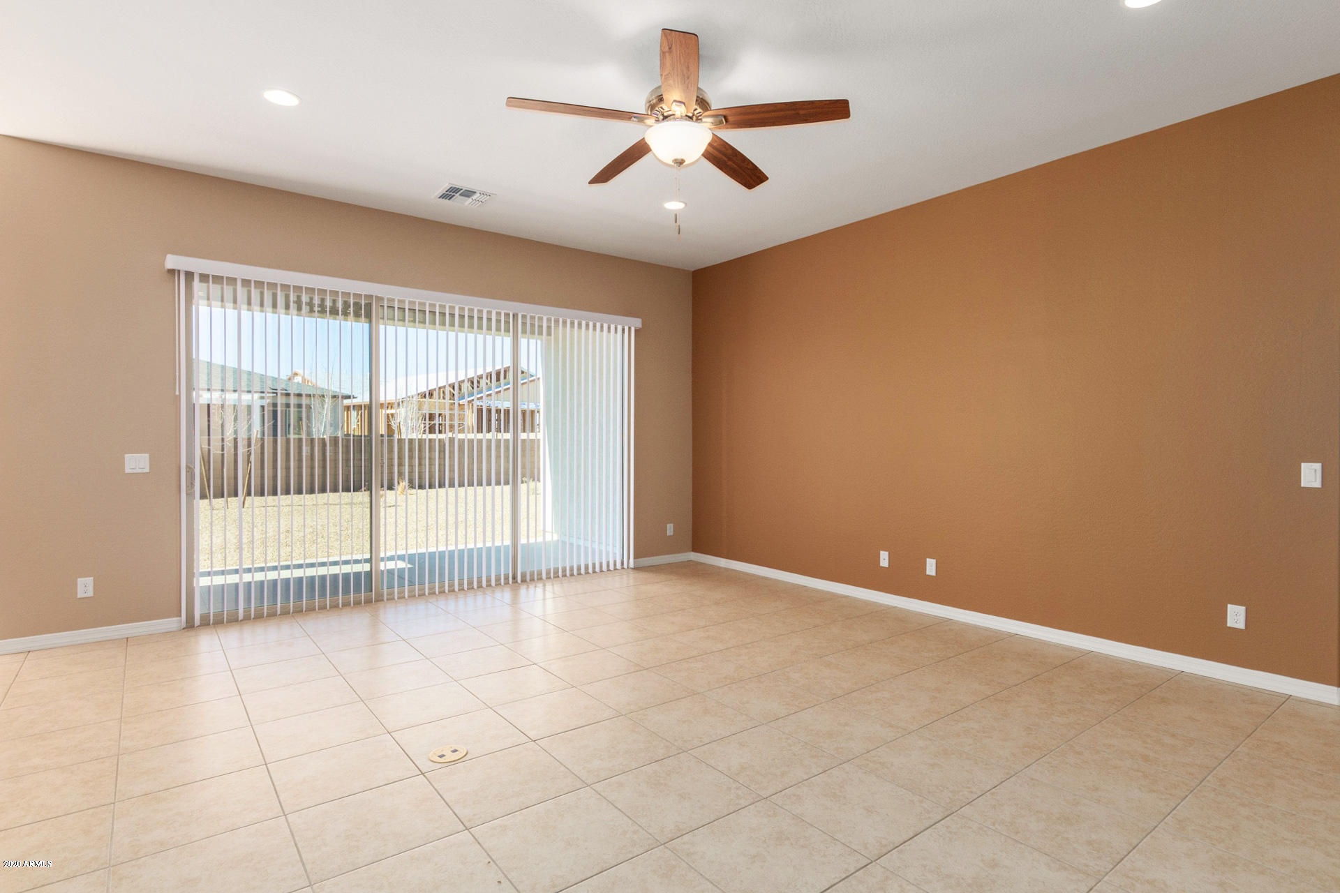 8642 Wandering Creek Road Prescott Valley, AZ 86315 - Photo 9 of 29 a view of an empty room with a window