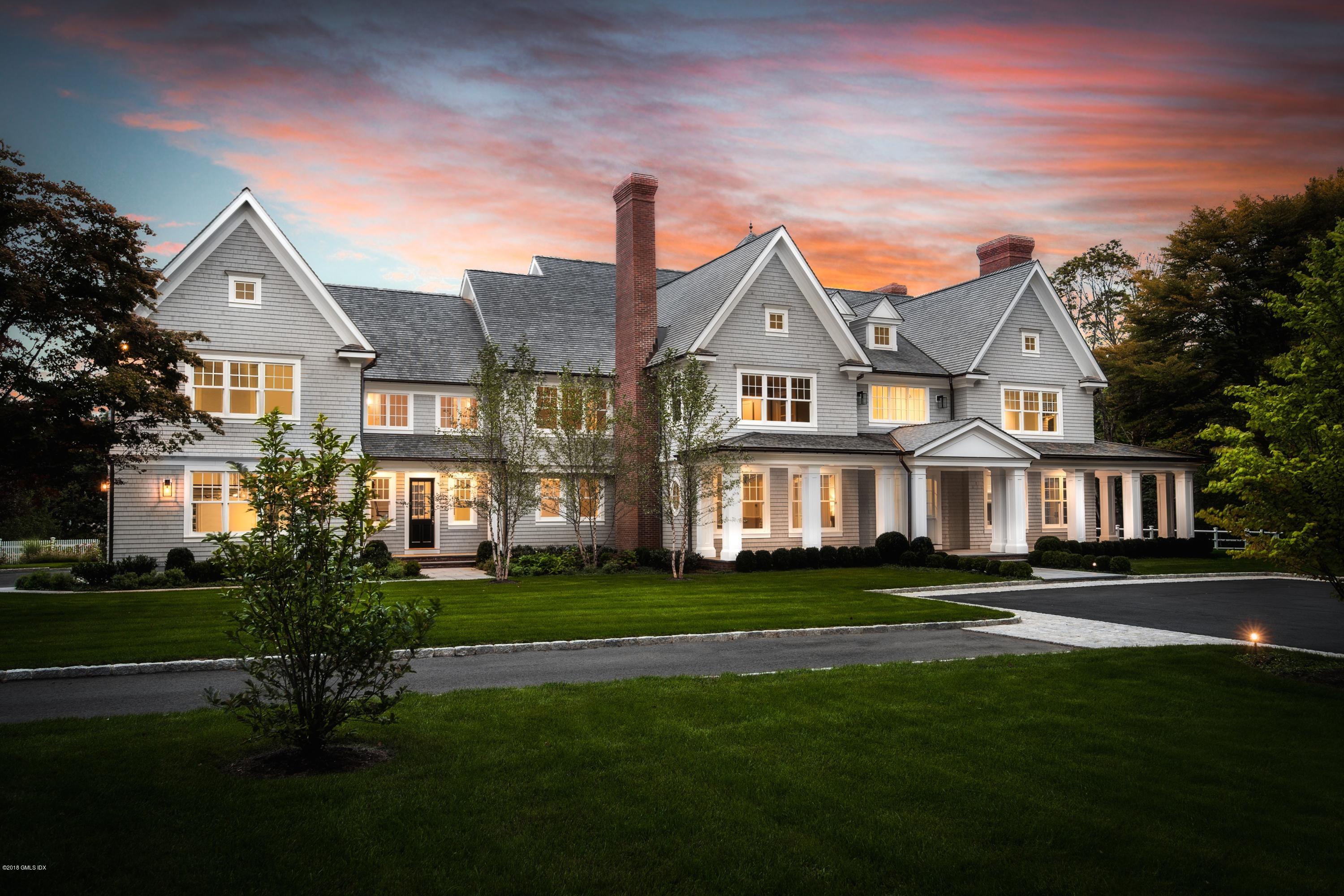 35 Mooreland Road Greenwich, CT 06831 - Photo 1 of 23 a front view of a house with a garden