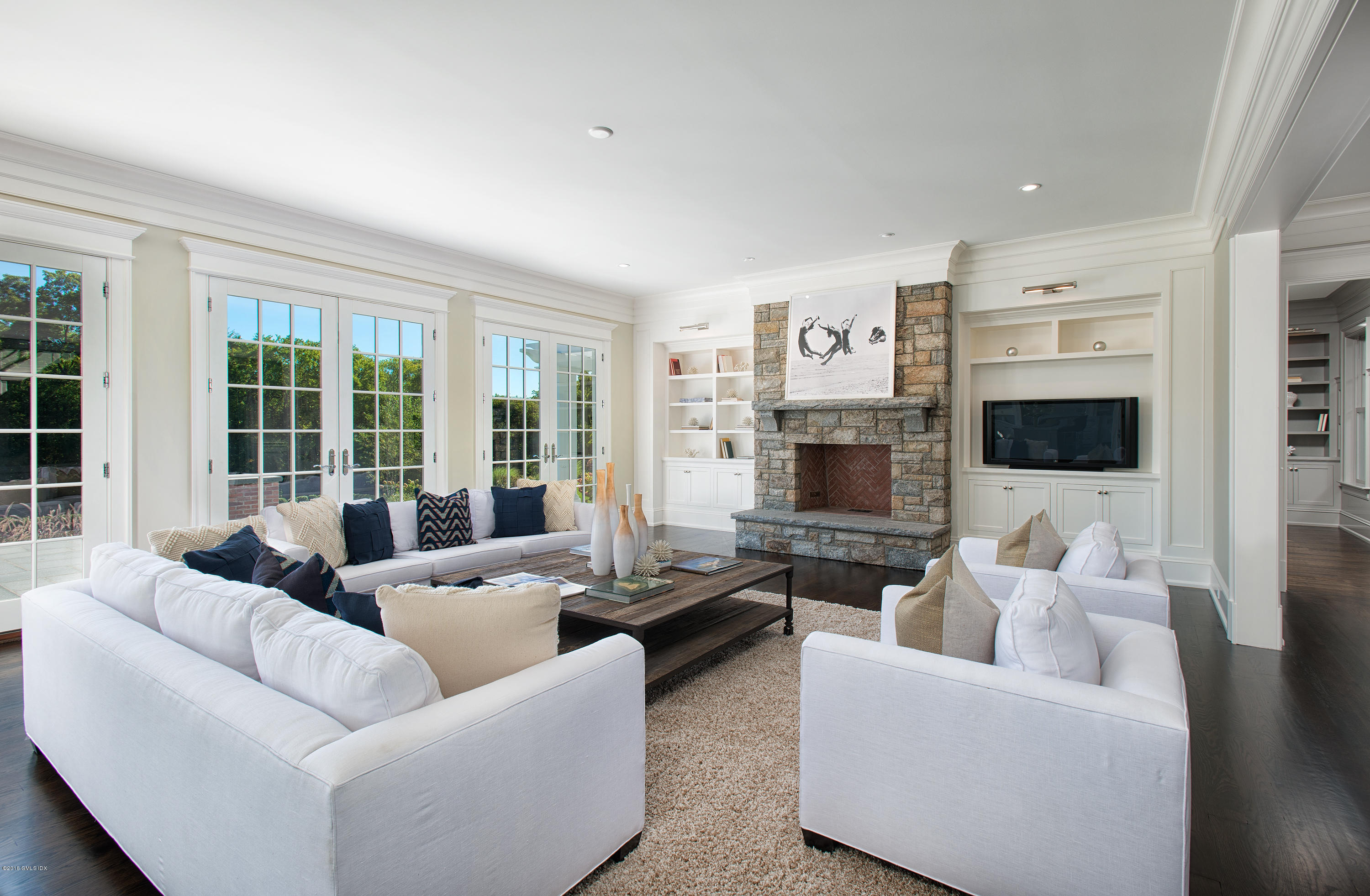 35 Mooreland Road Greenwich, CT 06831 - Photo 13 of 23 a living room with fireplace furniture and a flat screen tv