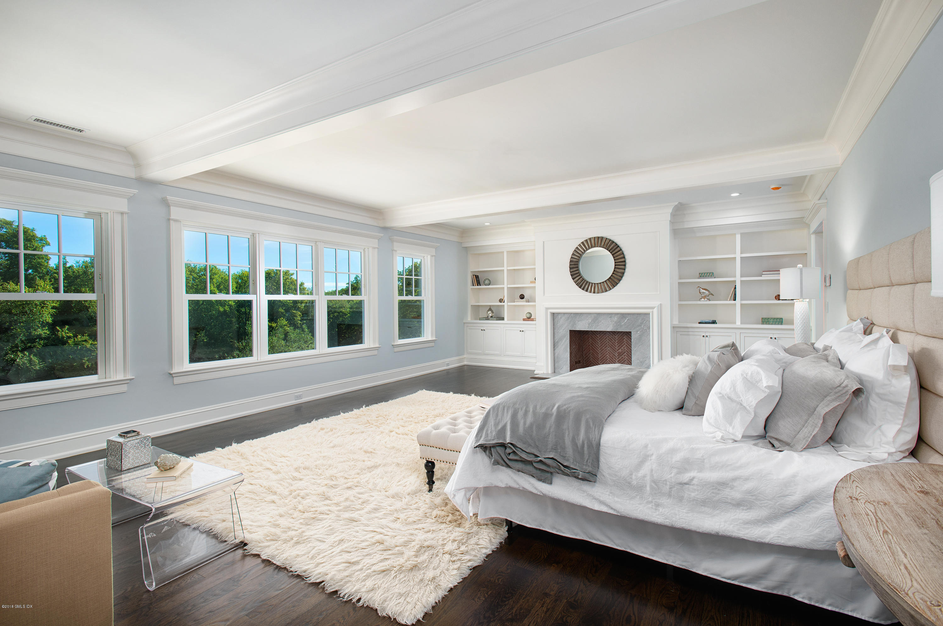 35 Mooreland Road Greenwich, CT 06831 - Photo 17 of 23 a bedroom with a bed and a fireplace