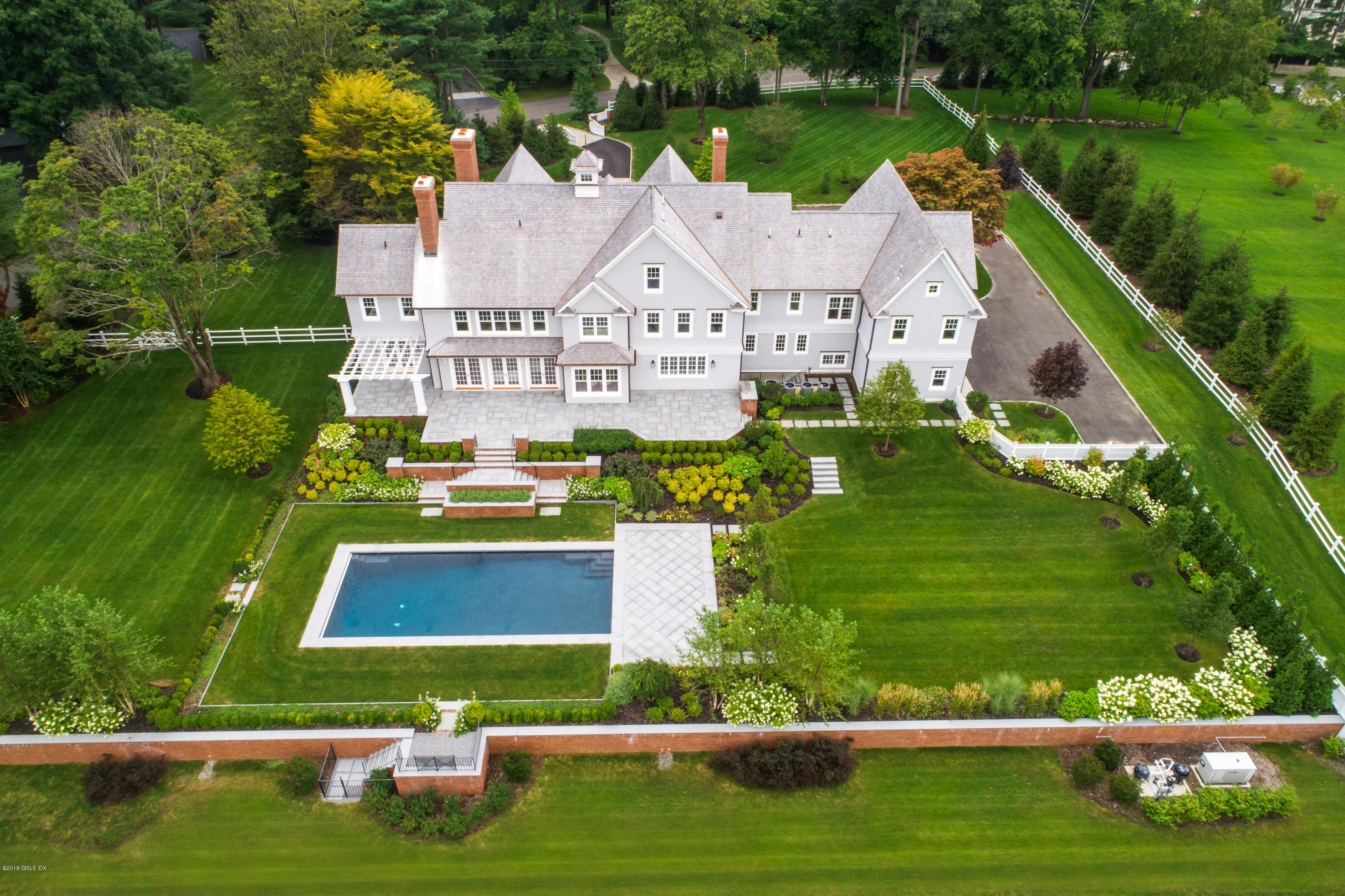 35 Mooreland Road Greenwich, CT 06831 - Photo 2 of 23 an aerial view of residential houses with outdoor space and swimming pool