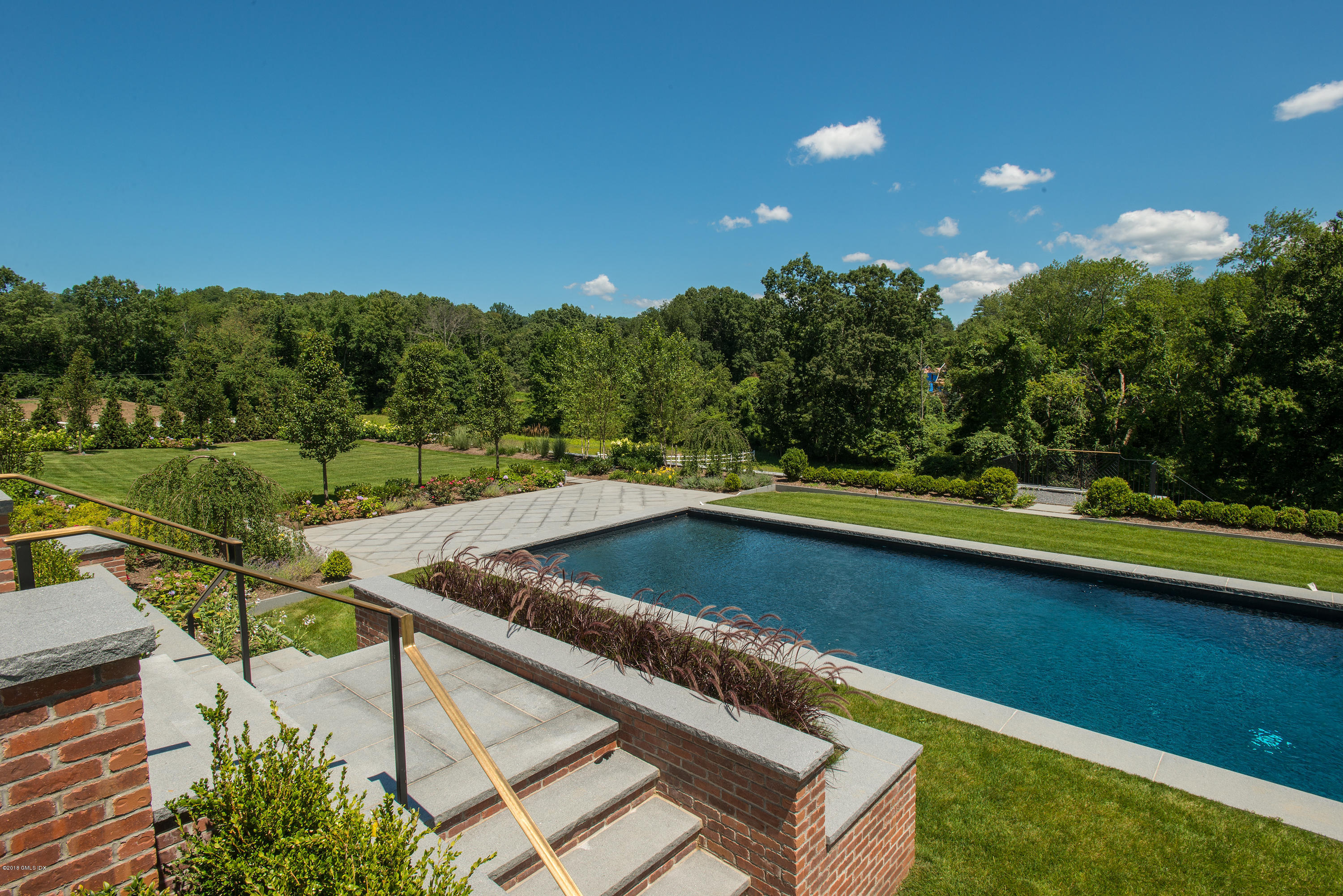 35 Mooreland Road Greenwich, CT 06831 - Photo 23 of 23 a view of a swimming pool with a yard