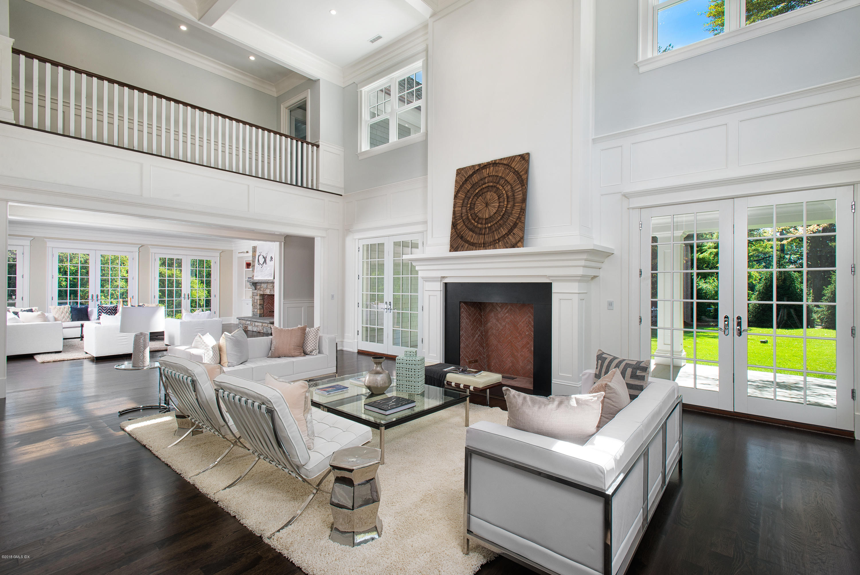 35 Mooreland Road Greenwich, CT 06831 - Photo 5 of 23 a living room with furniture and a fireplace with wooden floor