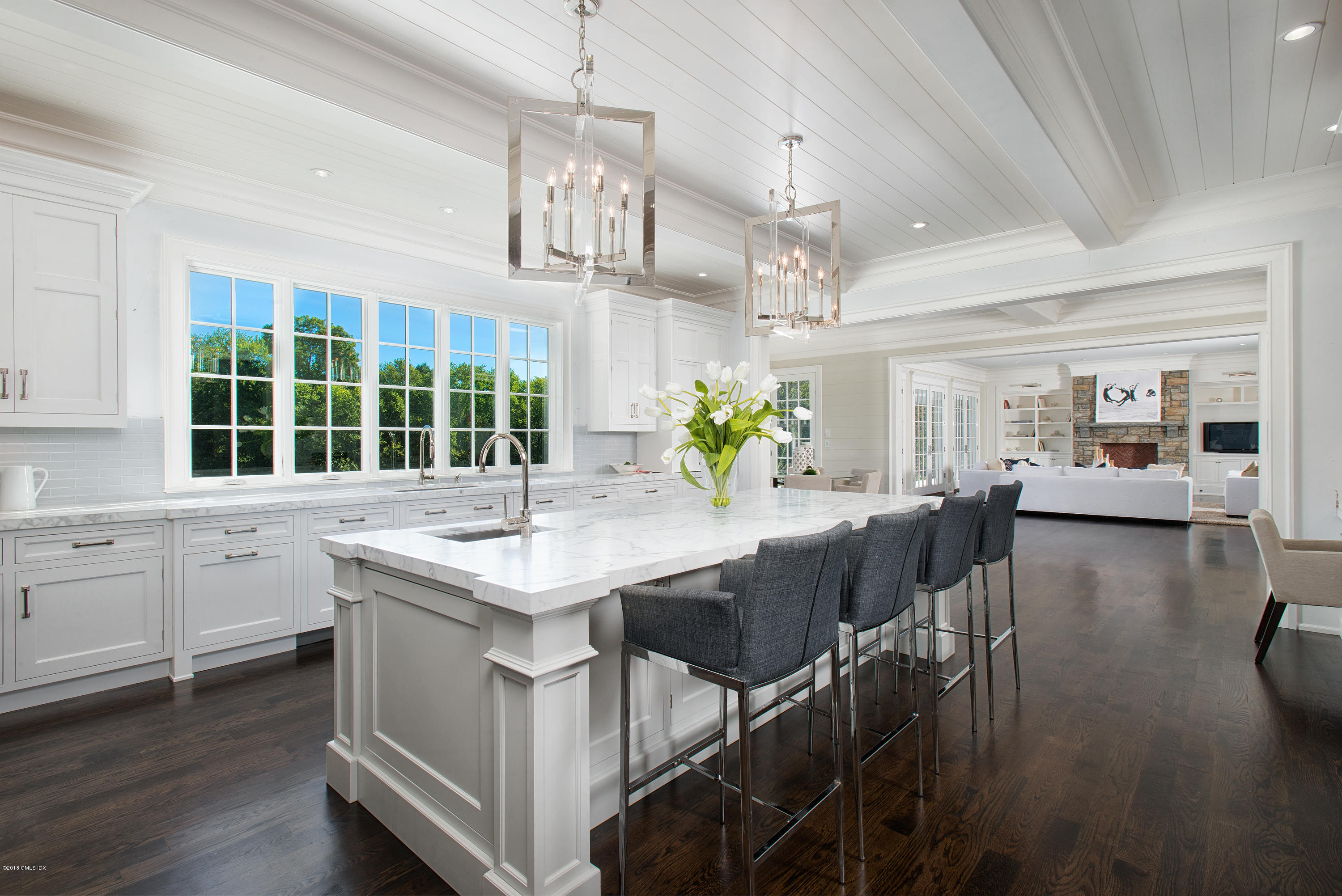35 Mooreland Road Greenwich, CT 06831 - Photo 10 of 23 a kitchen with granite countertop a table chairs and wooden floor