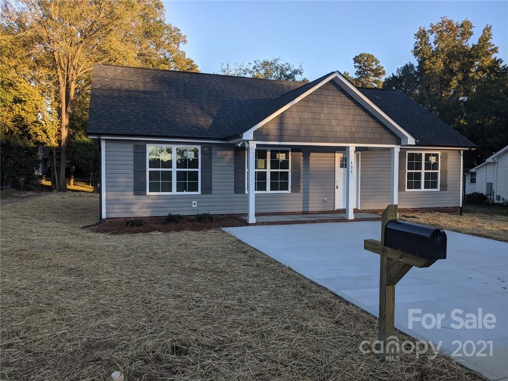 a front view of a house with yard