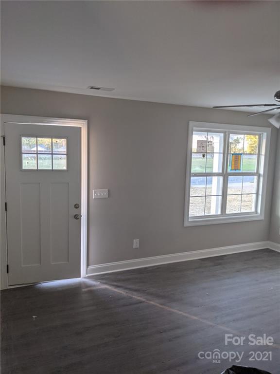 409 South Ridge Avenue Kannapolis, NC 28083 - Photo 7 of 13 a view of an empty room with wooden floor and a window