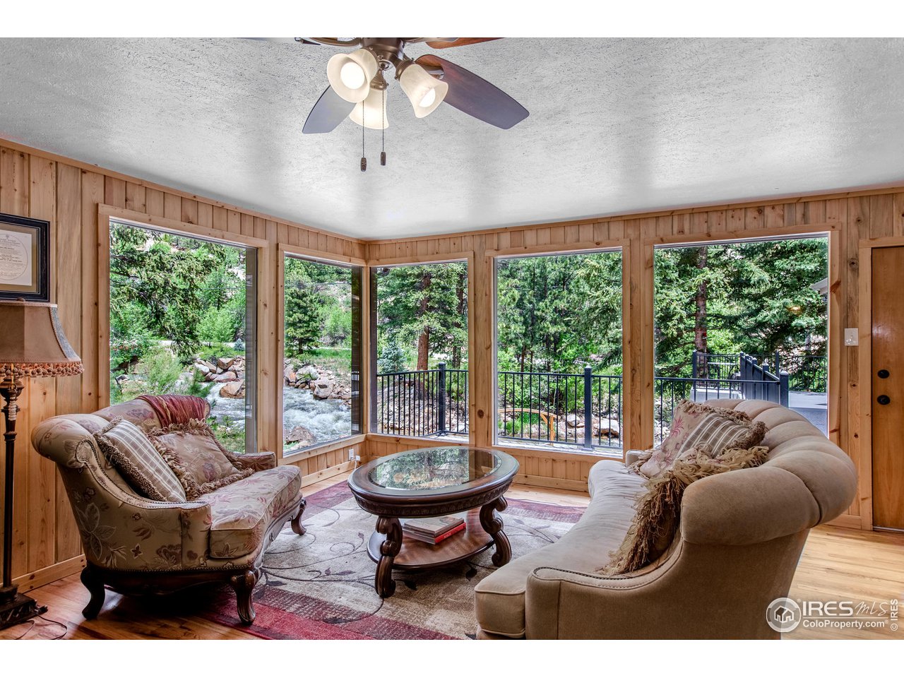 203 Riverside Drive Lyons, CO 80540 - Photo 8 of 36 Living Room with large windows