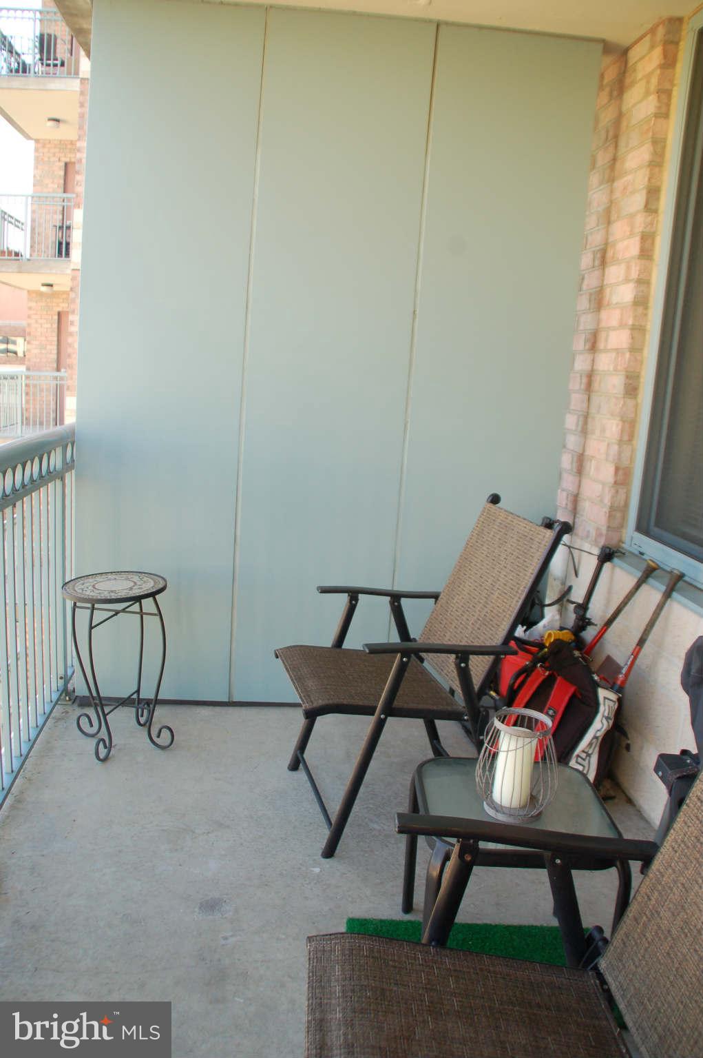 851 North Glebe Road, Unit 1015 Arlington, VA 22203 - Photo 16 of 19 a living room with furniture and a window