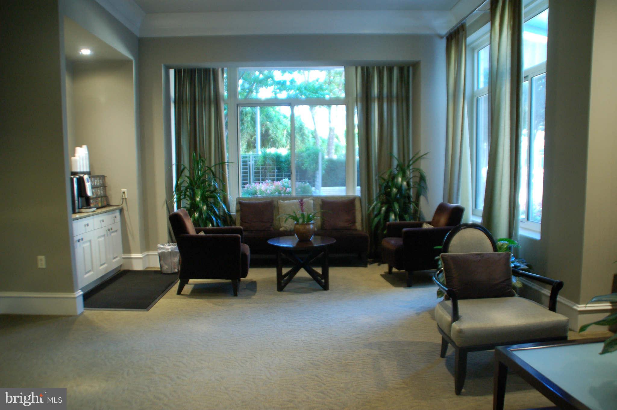 851 North Glebe Road, Unit 1015 Arlington, VA 22203 - Photo 3 of 19 a living room with furniture and a large window