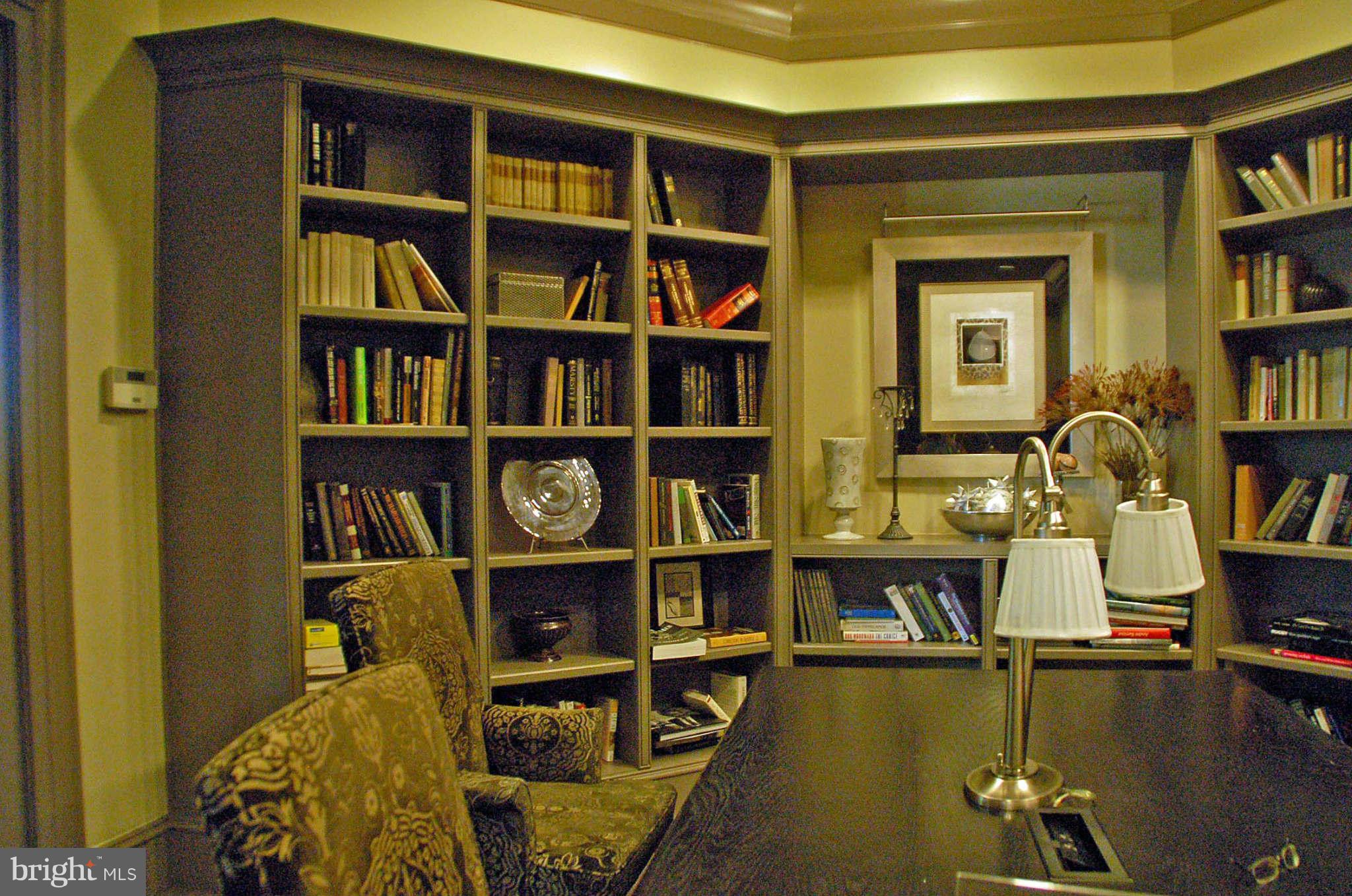 851 North Glebe Road, Unit 1015 Arlington, VA 22203 - Photo 5 of 19 a living room with bookshelf