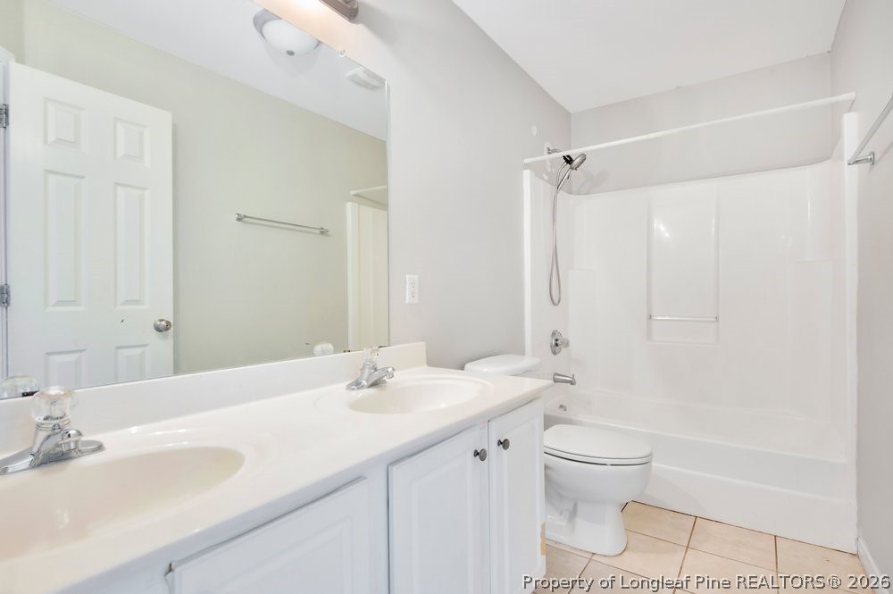 10 Pender Road Spring Lake, NC 28390 - Photo 20 of 35 a bathroom with a sink a toilet and shower