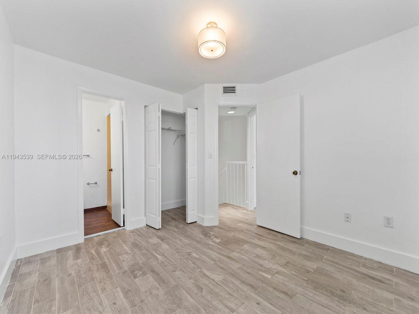 4560 Southwest 68th Ct Circle, Unit 619 Miami, FL 33155 - Photo 12 of 23 a view of empty room with wooden floor