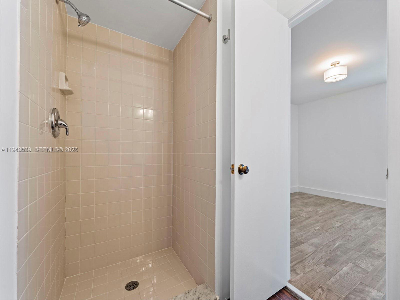 4560 Southwest 68th Ct Circle, Unit 619 Miami, FL 33155 - Photo 14 of 23 a bathroom with a shower