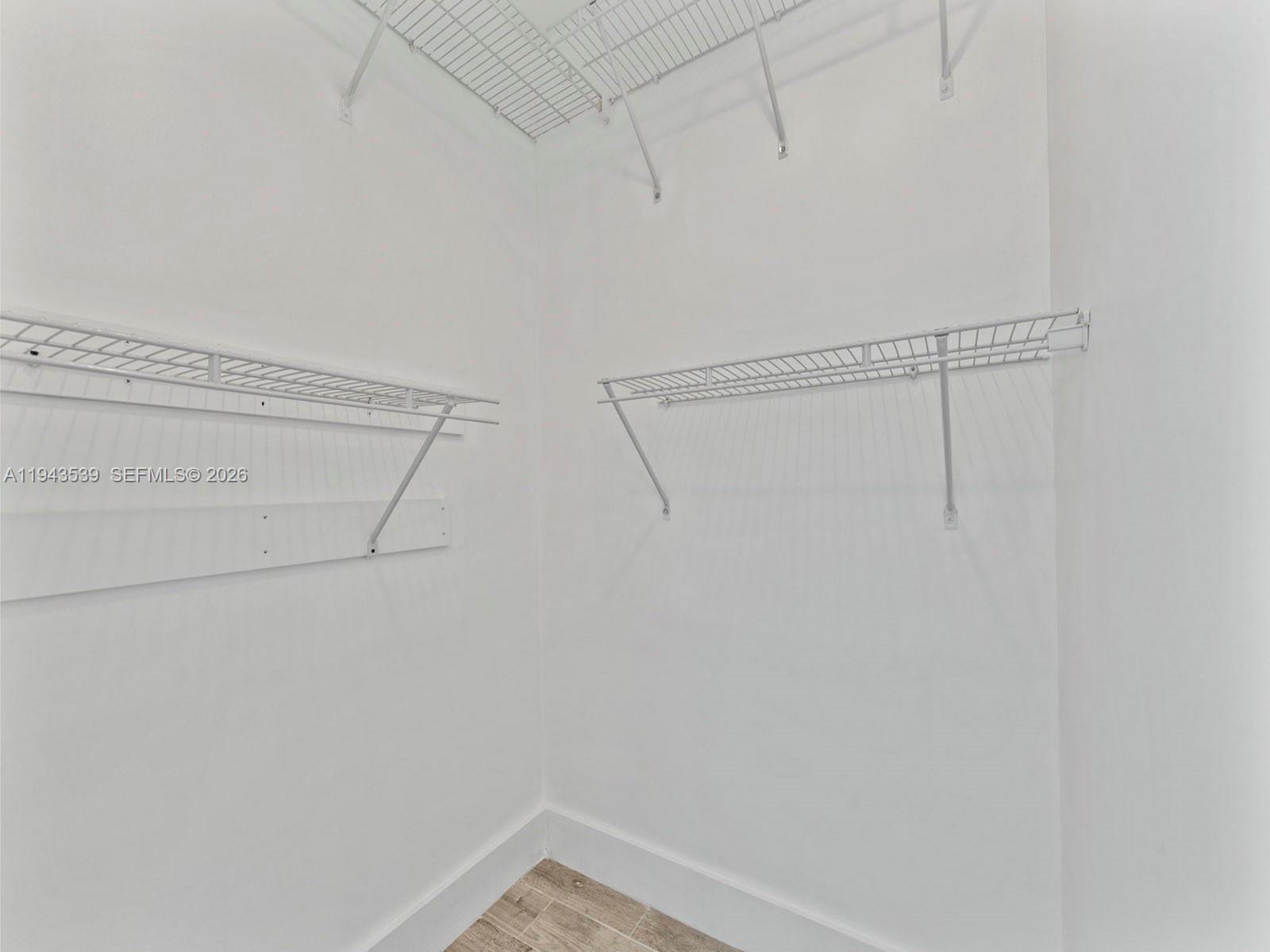 4560 Southwest 68th Ct Circle, Unit 619 Miami, FL 33155 - Photo 17 of 23 a view of small space with racks on the wall