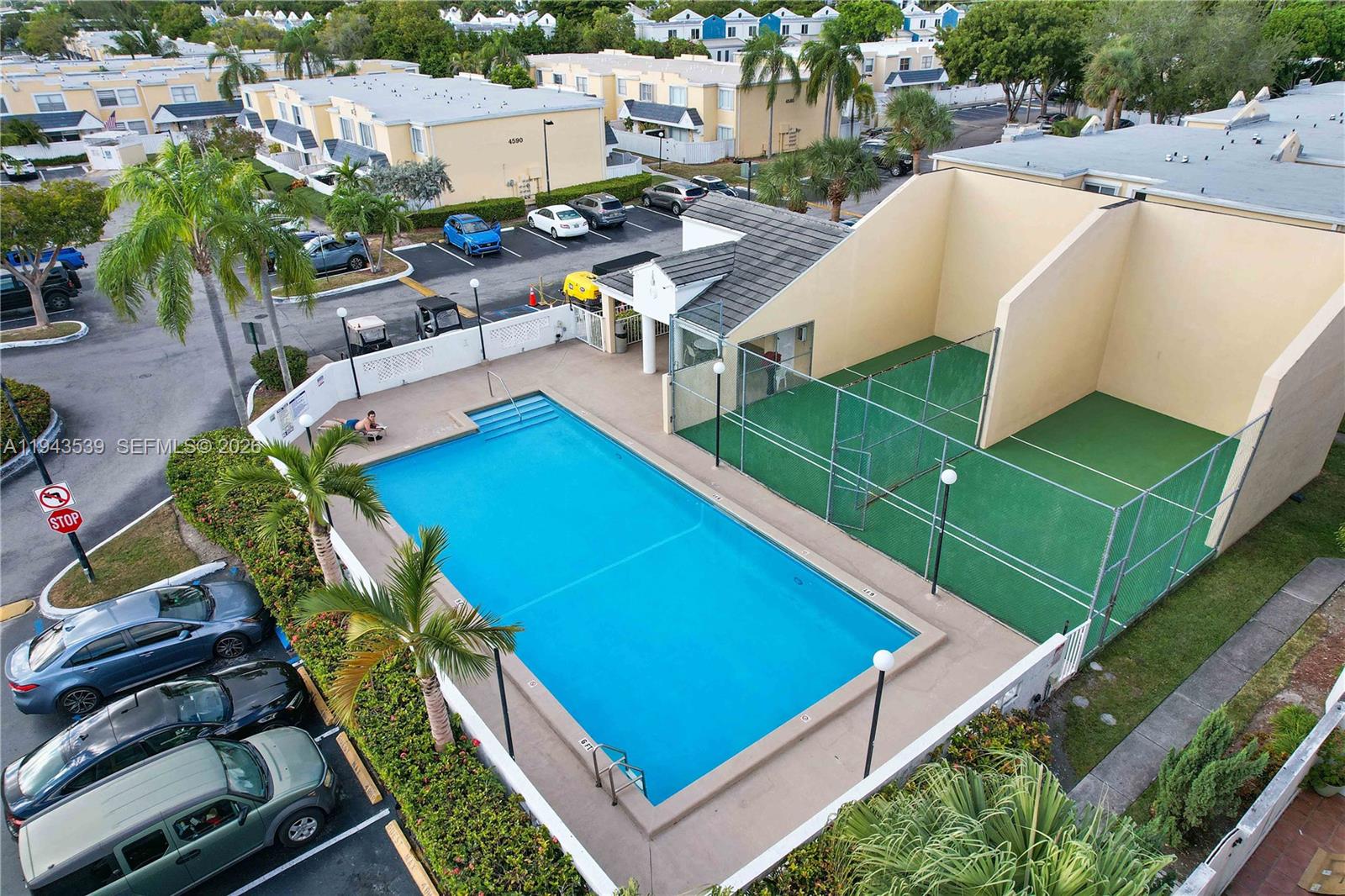 4560 Southwest 68th Ct Circle, Unit 619 Miami, FL 33155 - Photo 21 of 23 aerial view of a house with pool and chairs