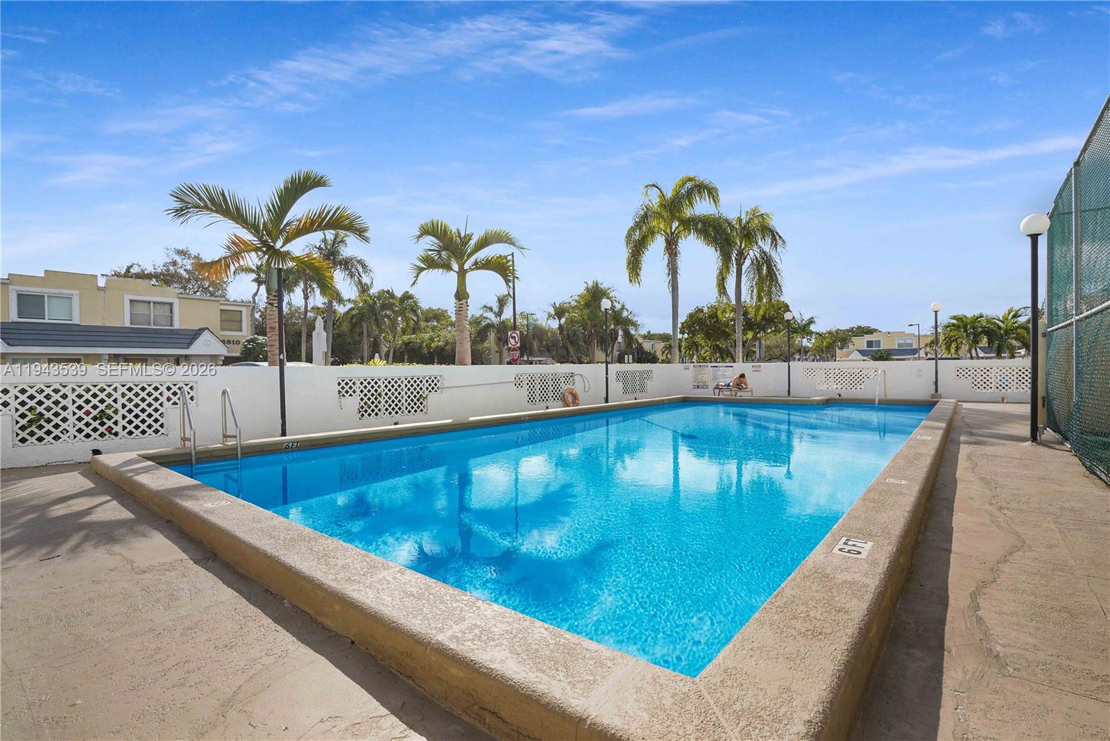 4560 Southwest 68th Ct Circle, Unit 619 Miami, FL 33155 - Photo 22 of 23 a view of swimming pool with a lounge chair