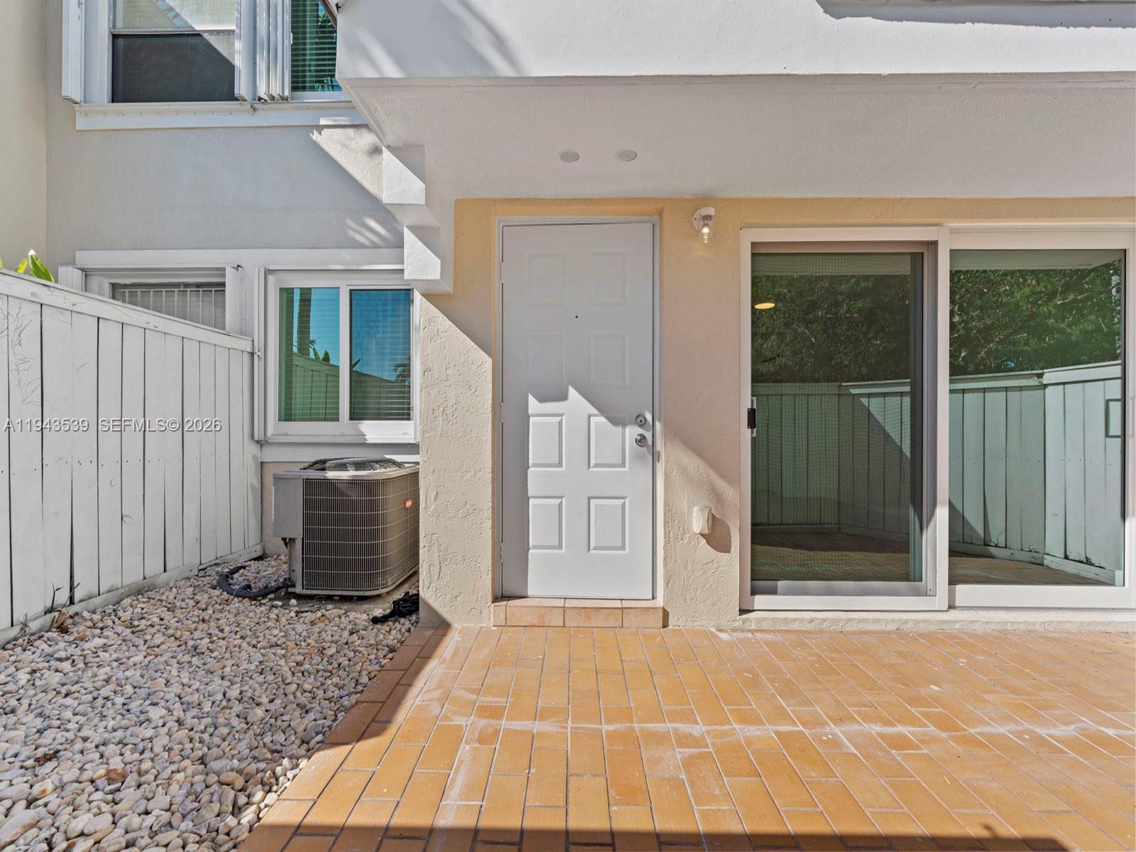 4560 Southwest 68th Ct Circle, Unit 619 Miami, FL 33155 - Photo 3 of 23 a house view with a backyard space