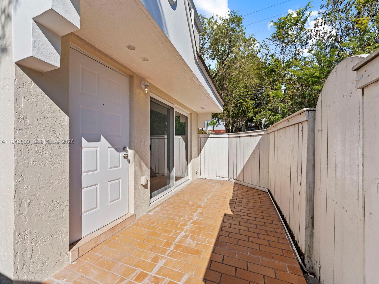 4560 Southwest 68th Ct Circle, Unit 619 Miami, FL 33155 - Photo 4 of 23 a view of wooden balcony