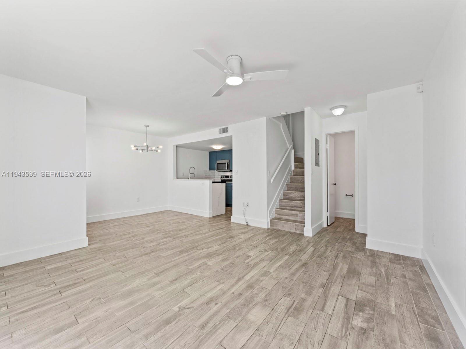 4560 Southwest 68th Ct Circle, Unit 619 Miami, FL 33155 - Photo 6 of 23 a view of empty room with wooden floor