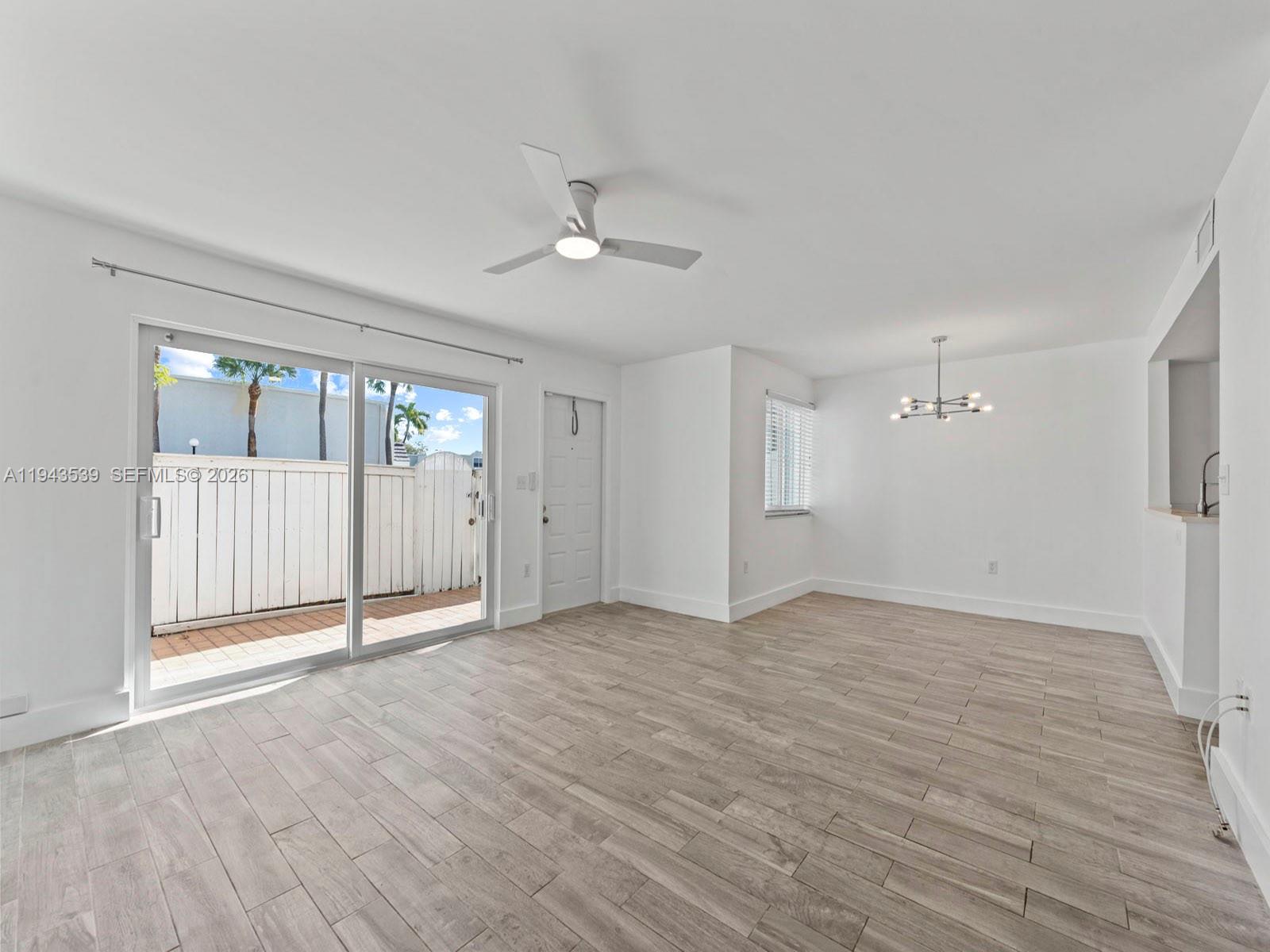 4560 Southwest 68th Ct Circle, Unit 619 Miami, FL 33155 - Photo 7 of 23 a view of an empty room with a window