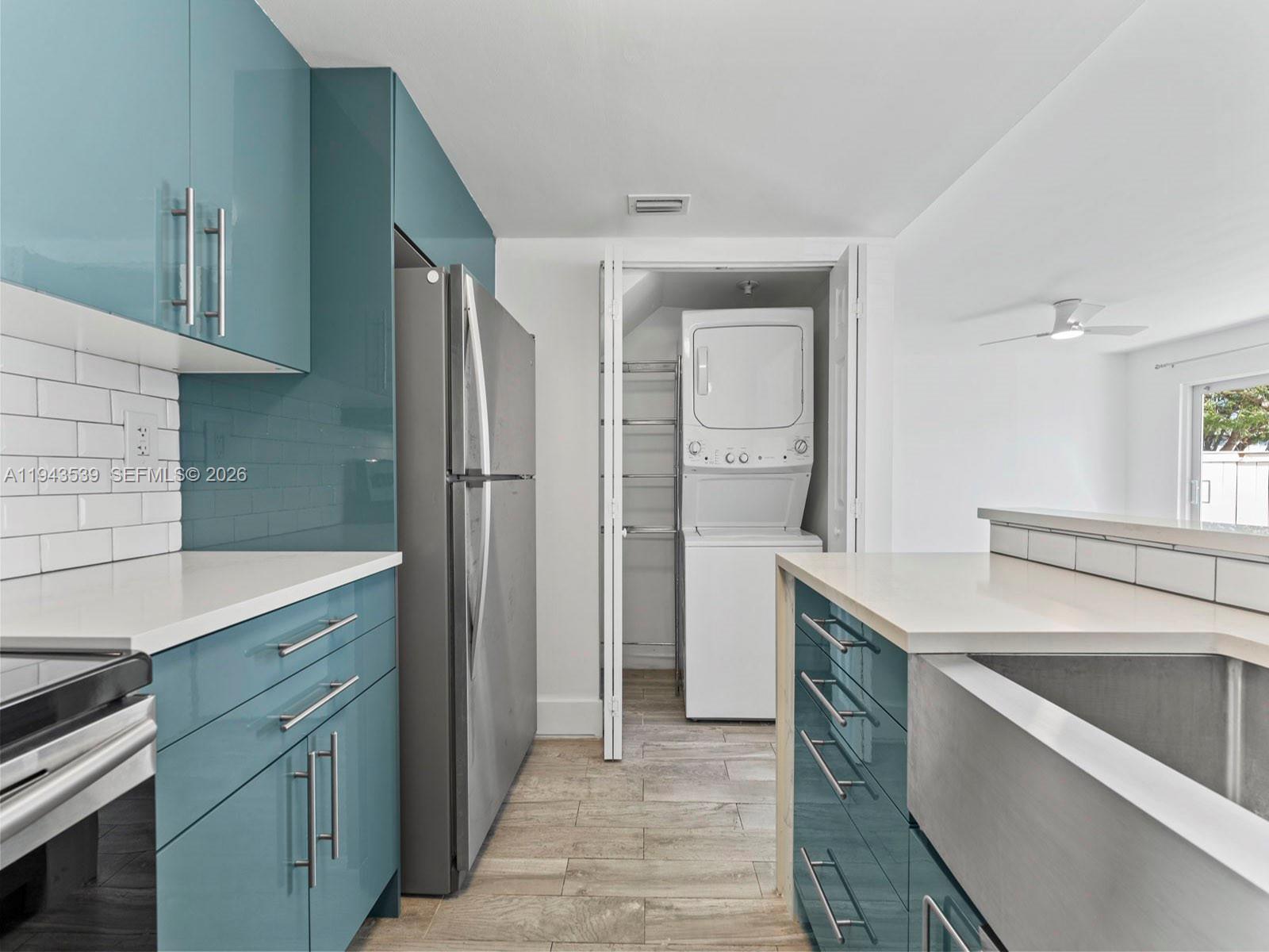 4560 Southwest 68th Ct Circle, Unit 619 Miami, FL 33155 - Photo 9 of 23 a kitchen with a sink stove and refrigerator