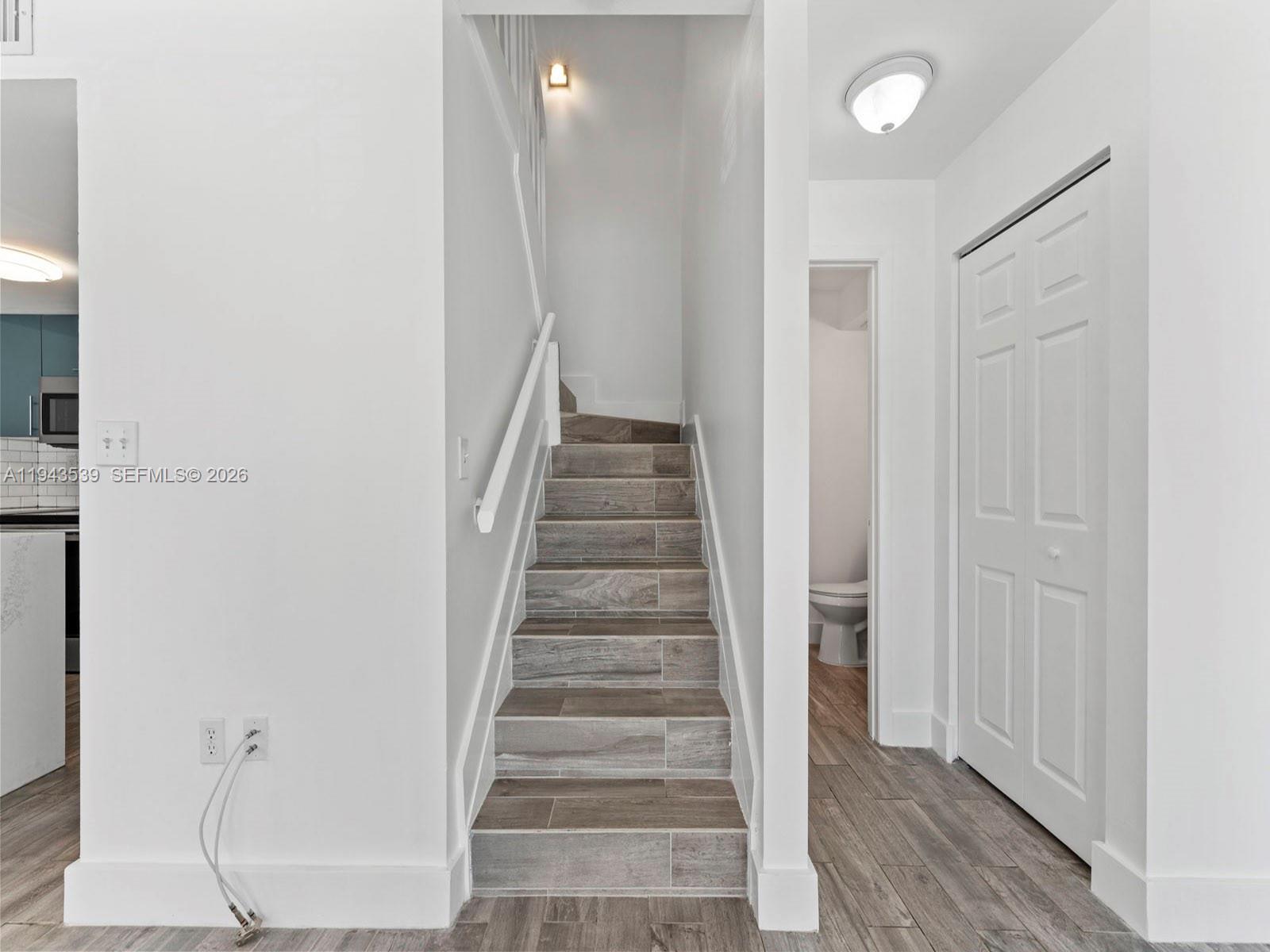 4560 Southwest 68th Ct Circle, Unit 619 Miami, FL 33155 - Photo 10 of 23 a view of entryway with wooden floor