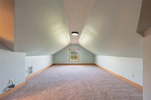 a view of a big room with windows