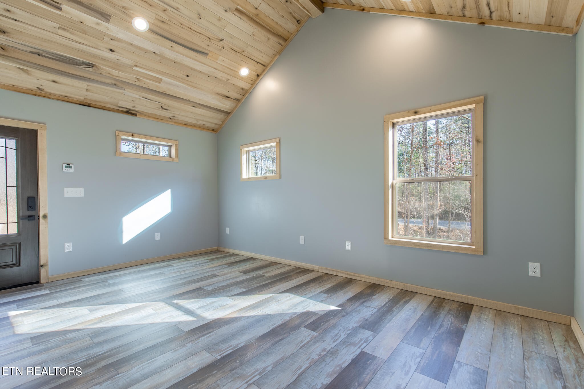 10795152 Shell Mountain Road Sevierville, TN 37876 - Photo 10 of 30 a view of an empty room window and wooden floor
