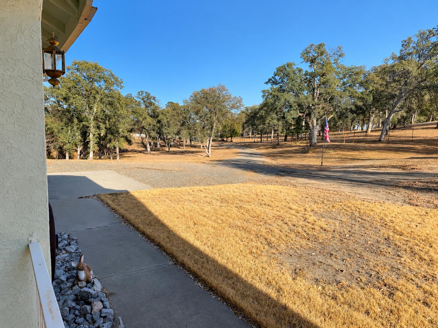 13725 Gas Point Road Igo, CA 96047 - Photo 10 of 23 Oak-Strewn Rural Yard with Flag