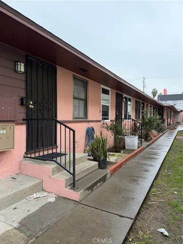 a front view of a house with chairs