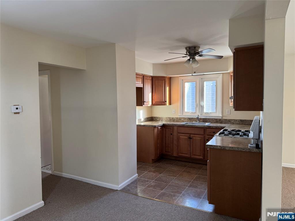 101 Halstead Avenue Wallington, NJ 07057 - Photo 2 of 11 a kitchen with granite countertop a sink stainless steel appliances and cabinets