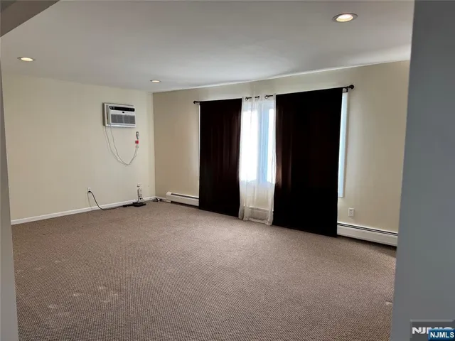 a view of an empty room with a closet